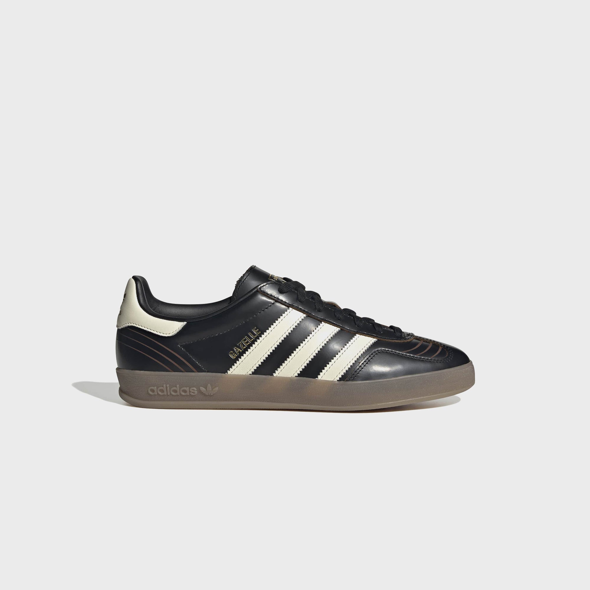 black and white leather gazelles