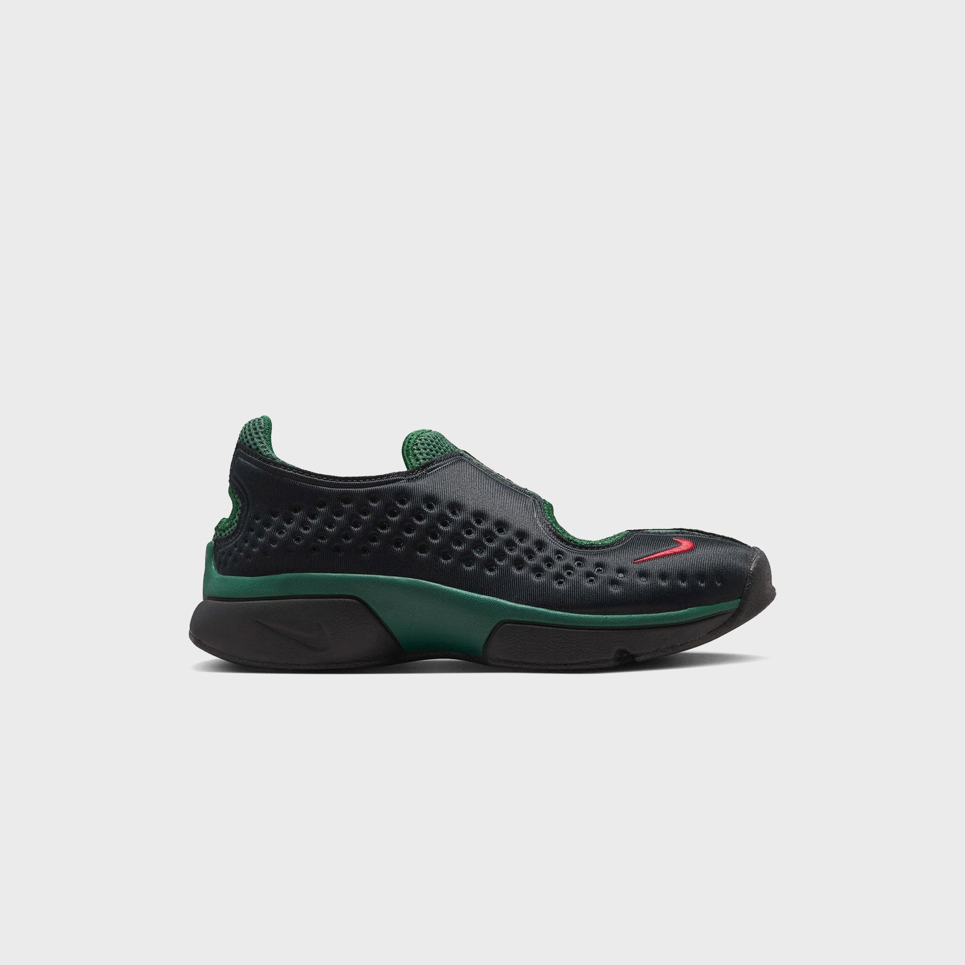 Nike WMNS Rift 2 in Black and Team Dark Green, lateral side profile, perforated upper with red swoosh