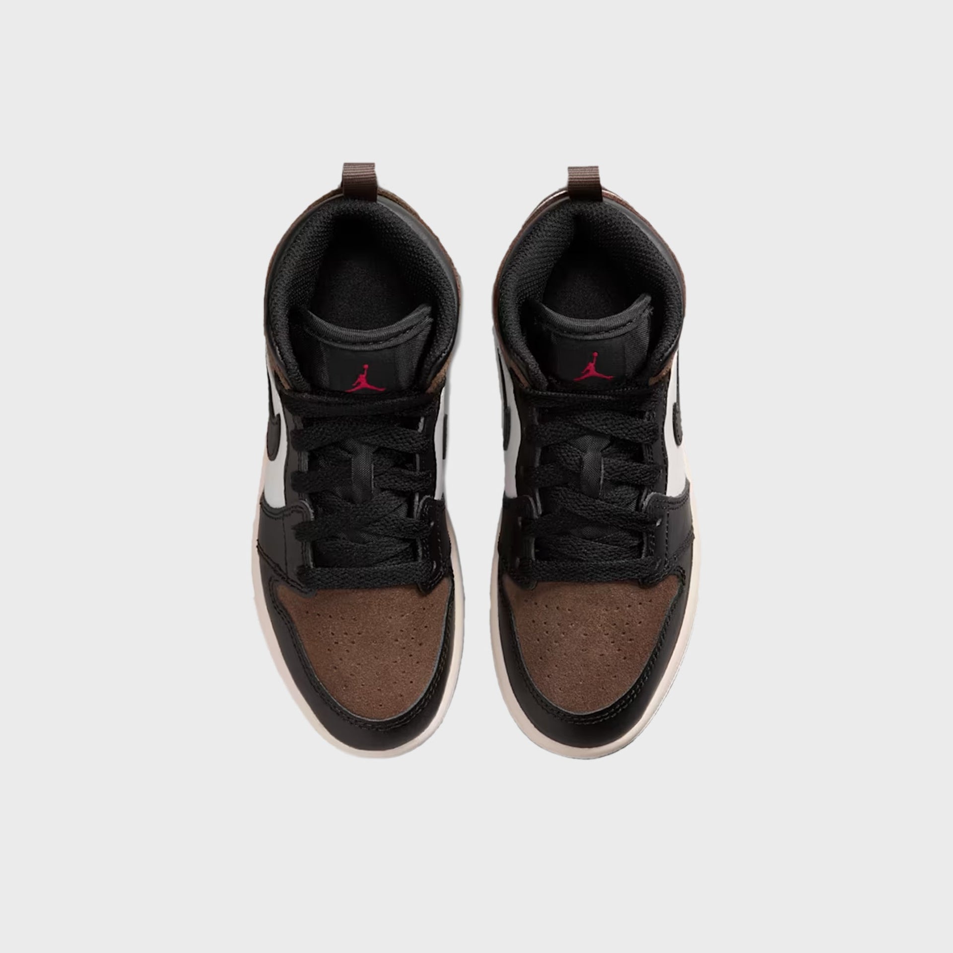 PS Air Jordan 1 Mid pair from above with black lining and red Jumpman tongues over brown suede