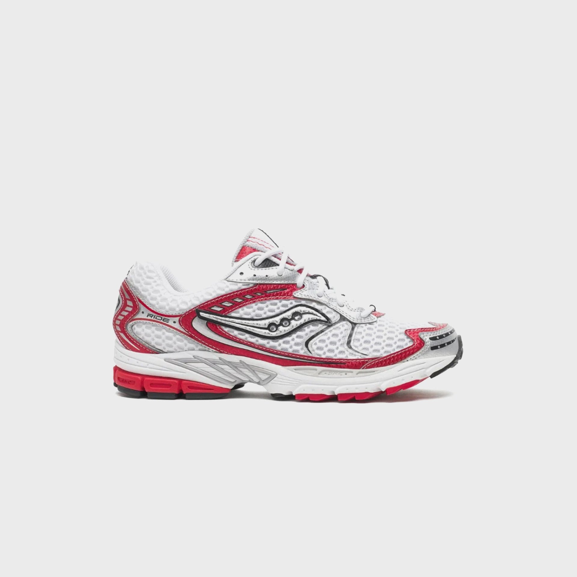 Saucony Progrid Ride 1 running shoe in white mesh with racing red and black overlays, lateral side view