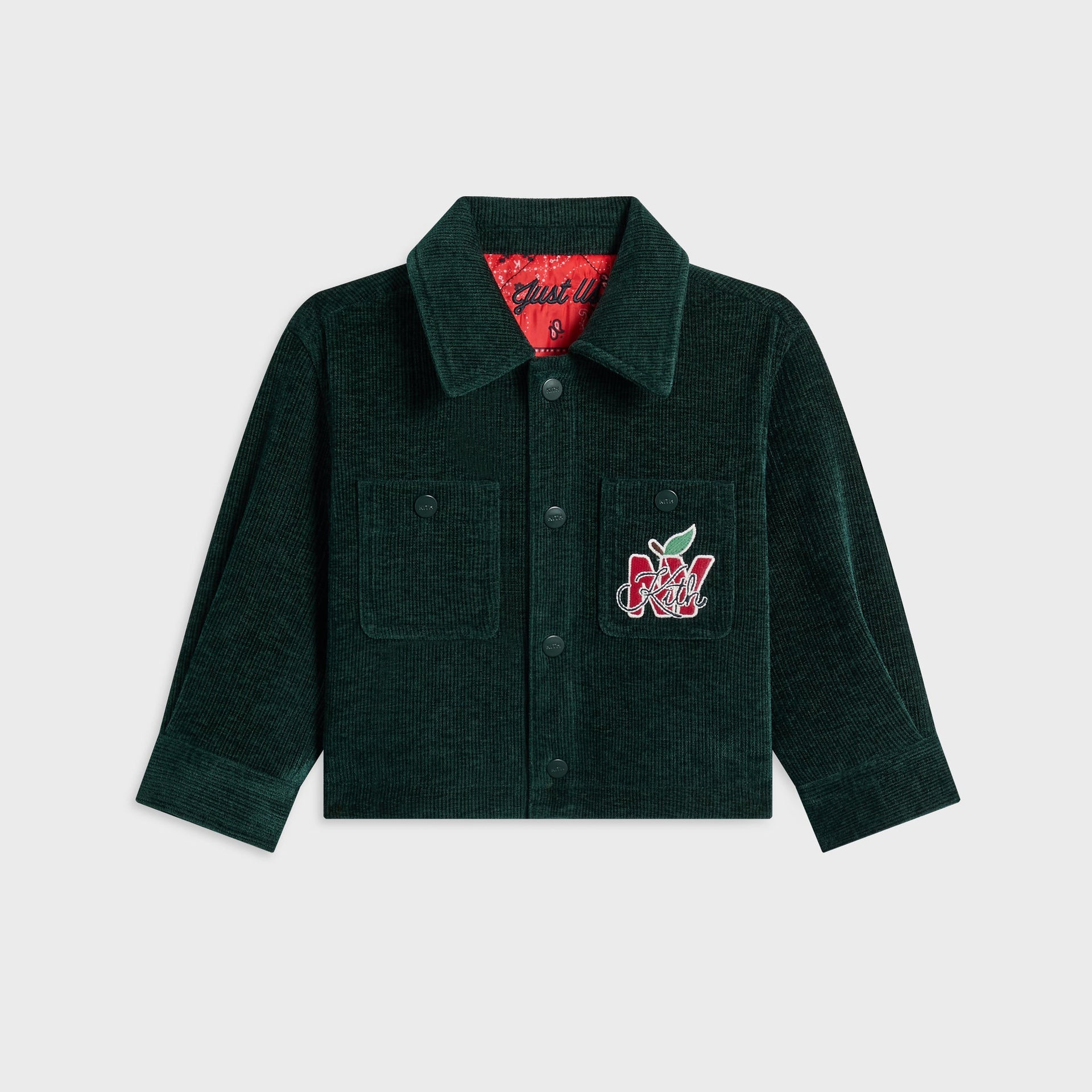Kith Baby Reversible Ora Shacket, front flat lay of dark green corduroy side with chest pockets and NY apple Kith patch
