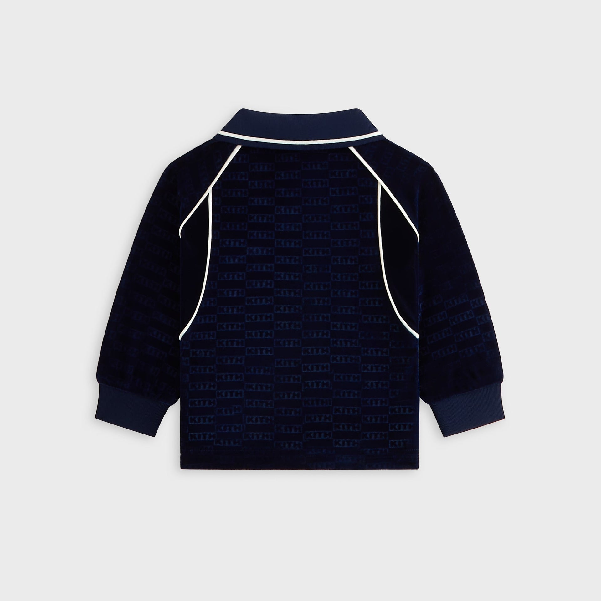 Kith Baby Long Sleeve Soccer Jersey Polo in navy velour, back flat lay with KITH monogram and cream piping