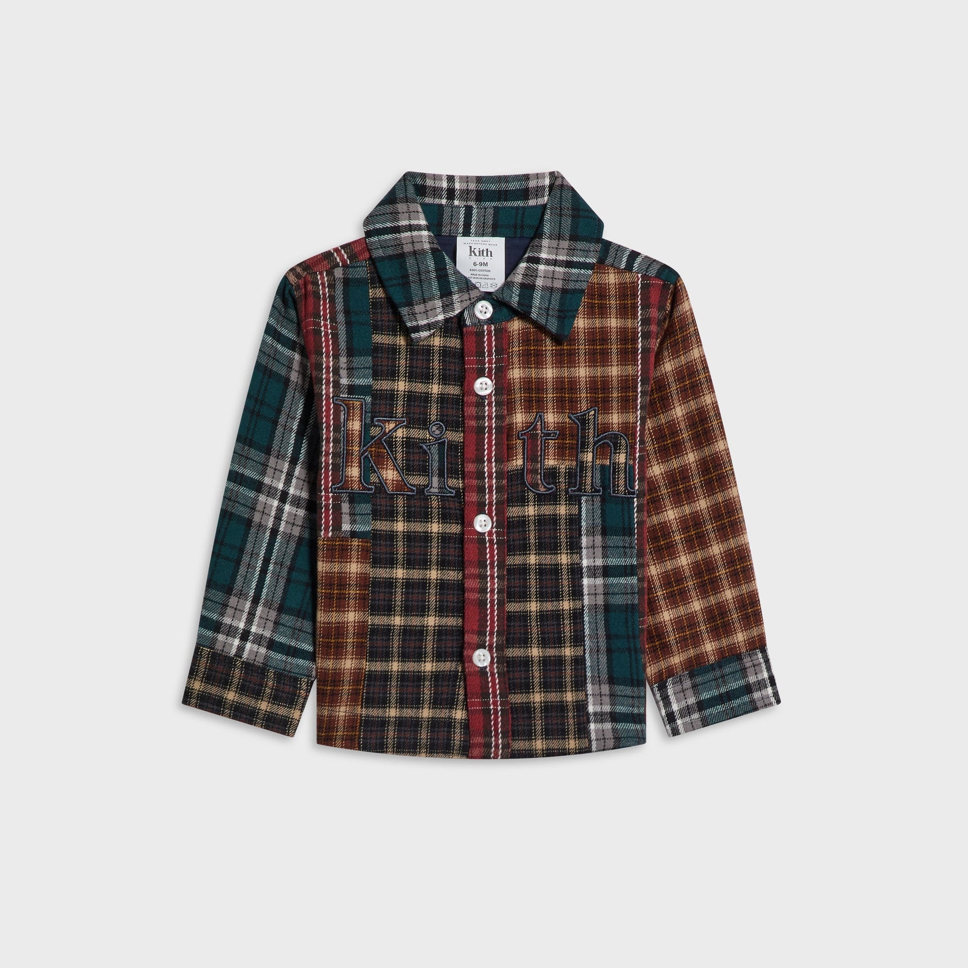 Kith Baby Patchwork Plaid Apollo Shirt in Chest colorway, flat lay front view with embroidered Kith chest logo and mixed plaid panels in green, red, black and tan