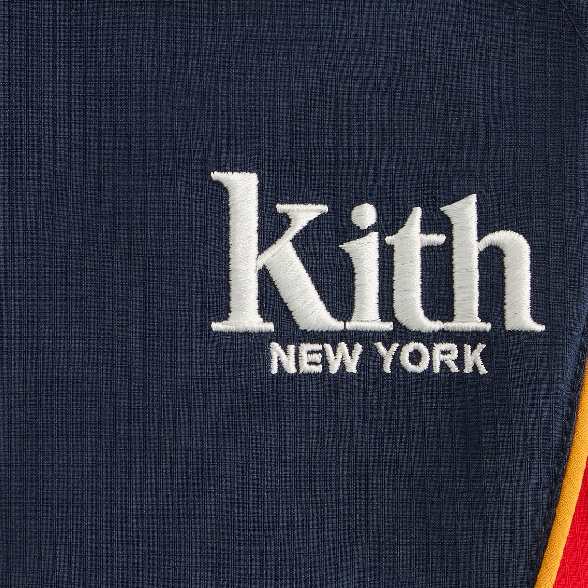 Kith Baby Mercer 8 Pant close-up of white Kith New York embroidery on navy ripstop
