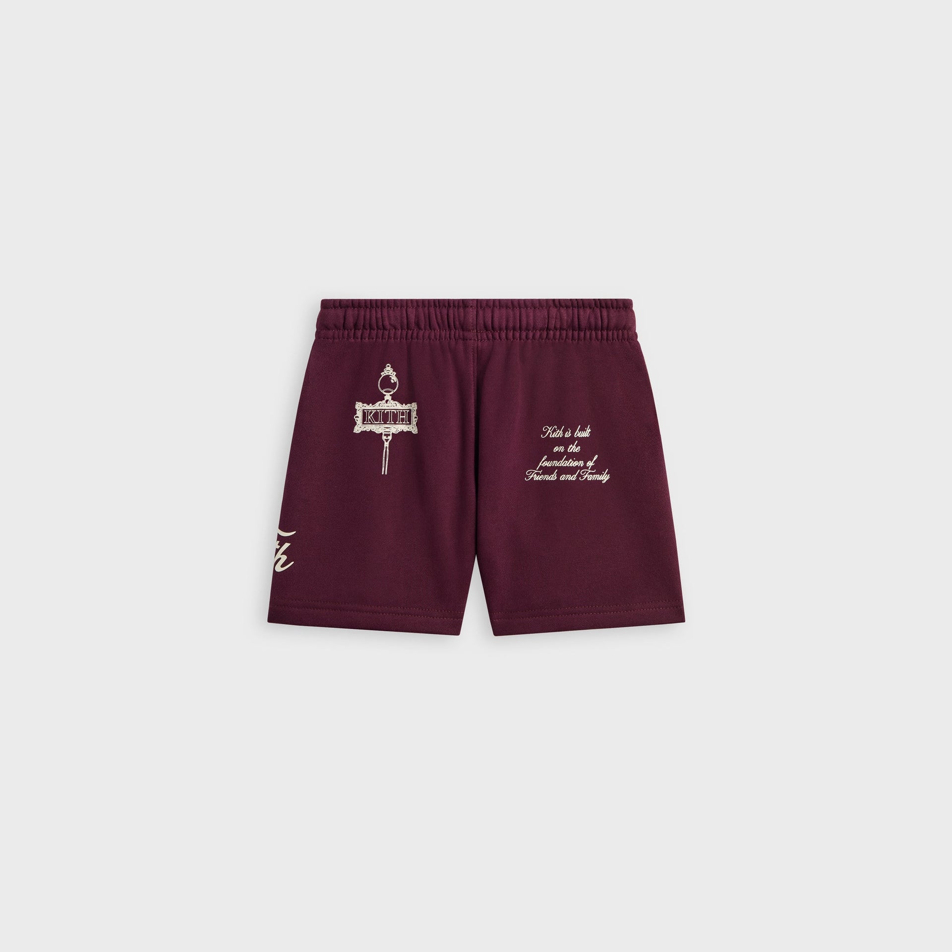 Kith Baby Logo Nelson Short in burgundy, back flat lay with cream Kith crest and Friends and Family text