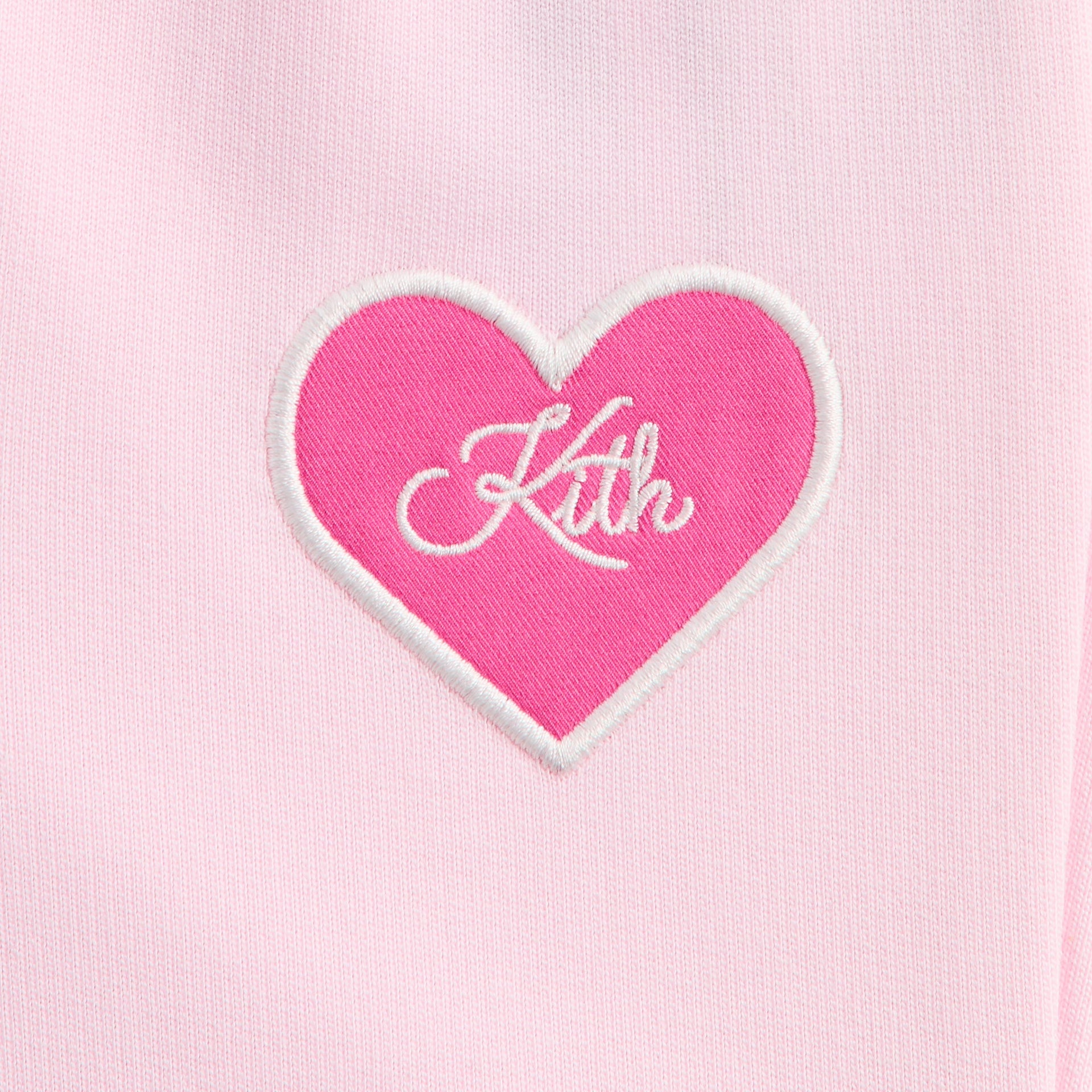 Kith Baby Alani Sweatpant close-up of pink heart patch with white Kith script