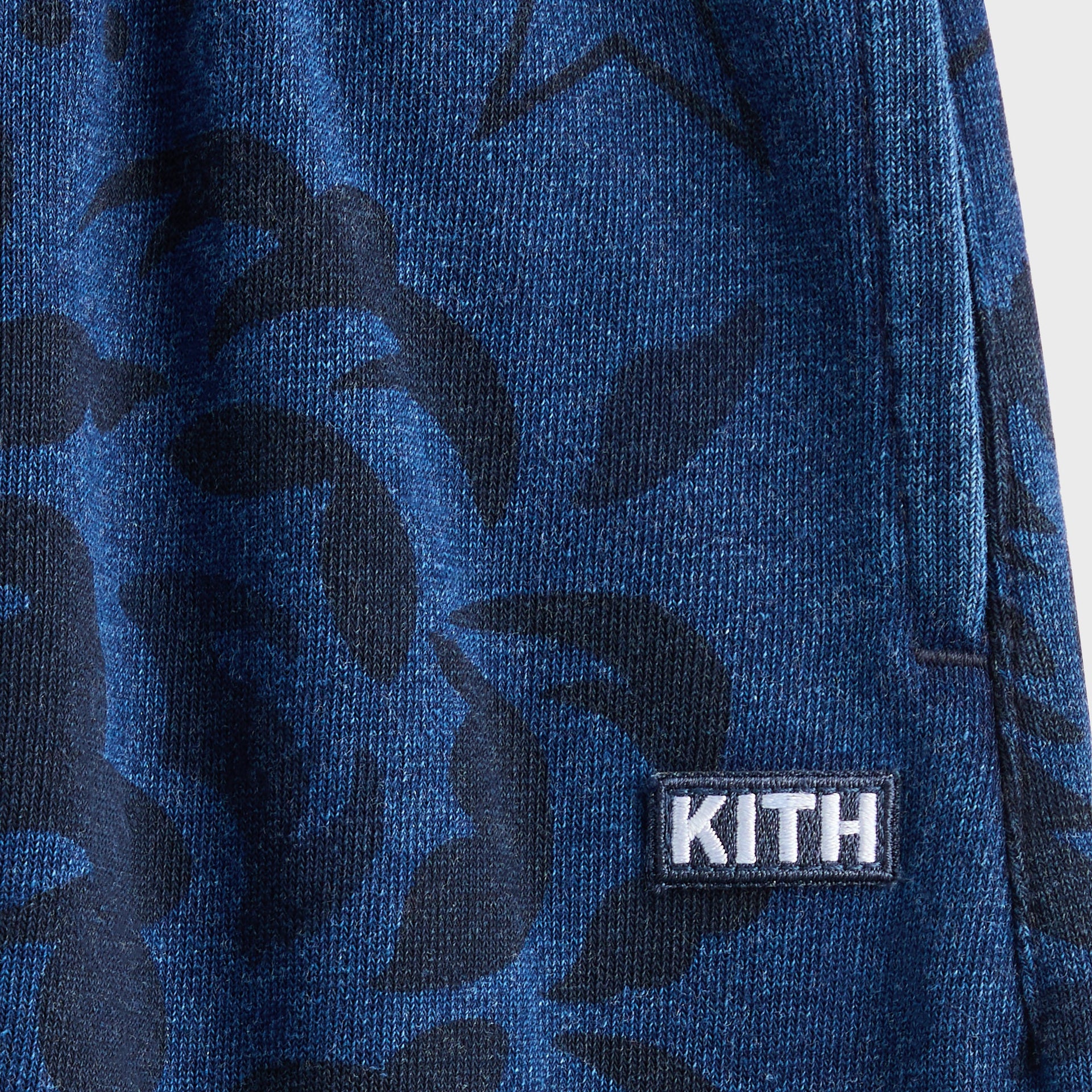 Kith Baby Paisley Nelson Sweatpant in Dark Indigo, close-up of paisley print with embroidered KITH box logo patch
