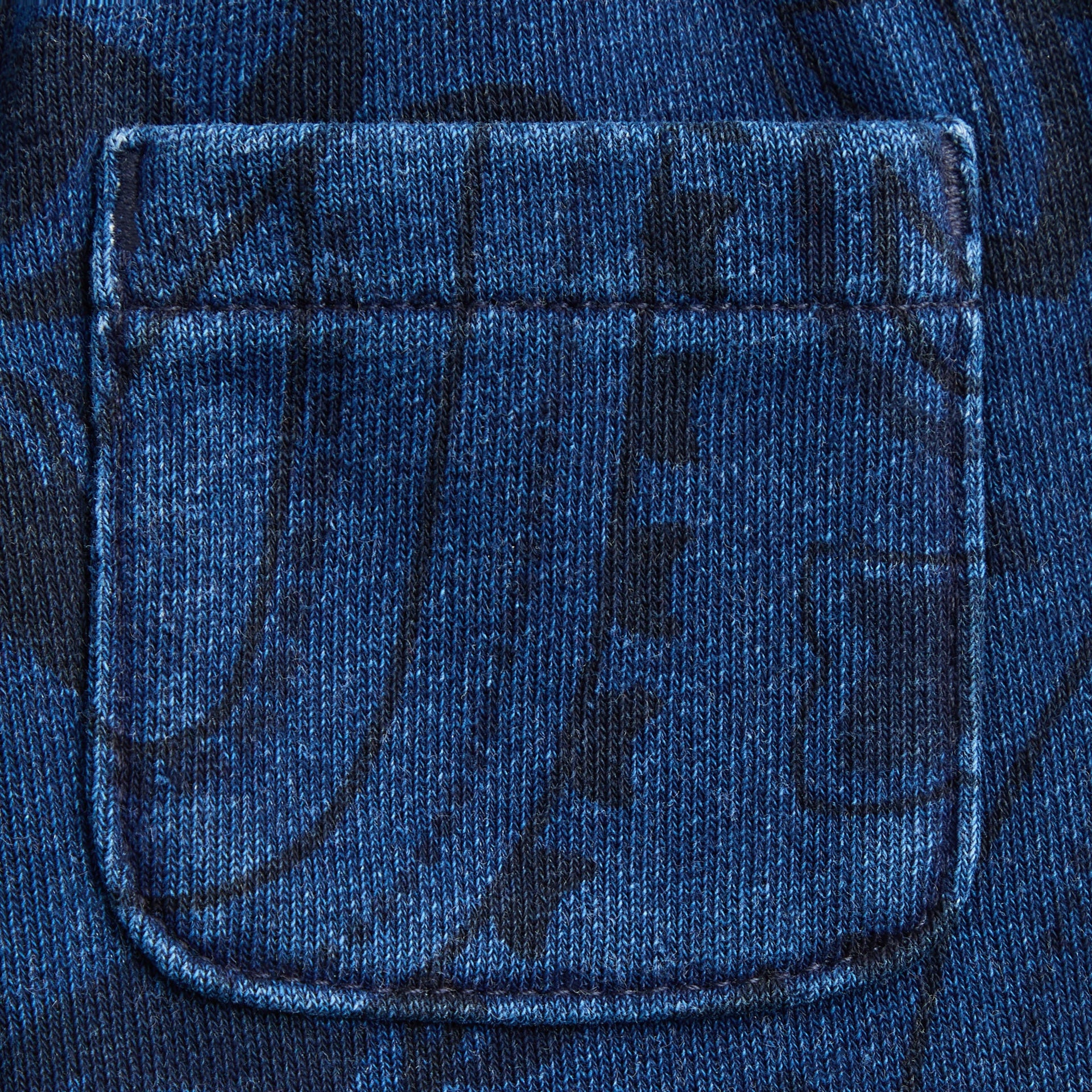 Kith Baby Paisley Nelson Sweatpant in Dark Indigo, close-up of back patch pocket on paisley printed fabric