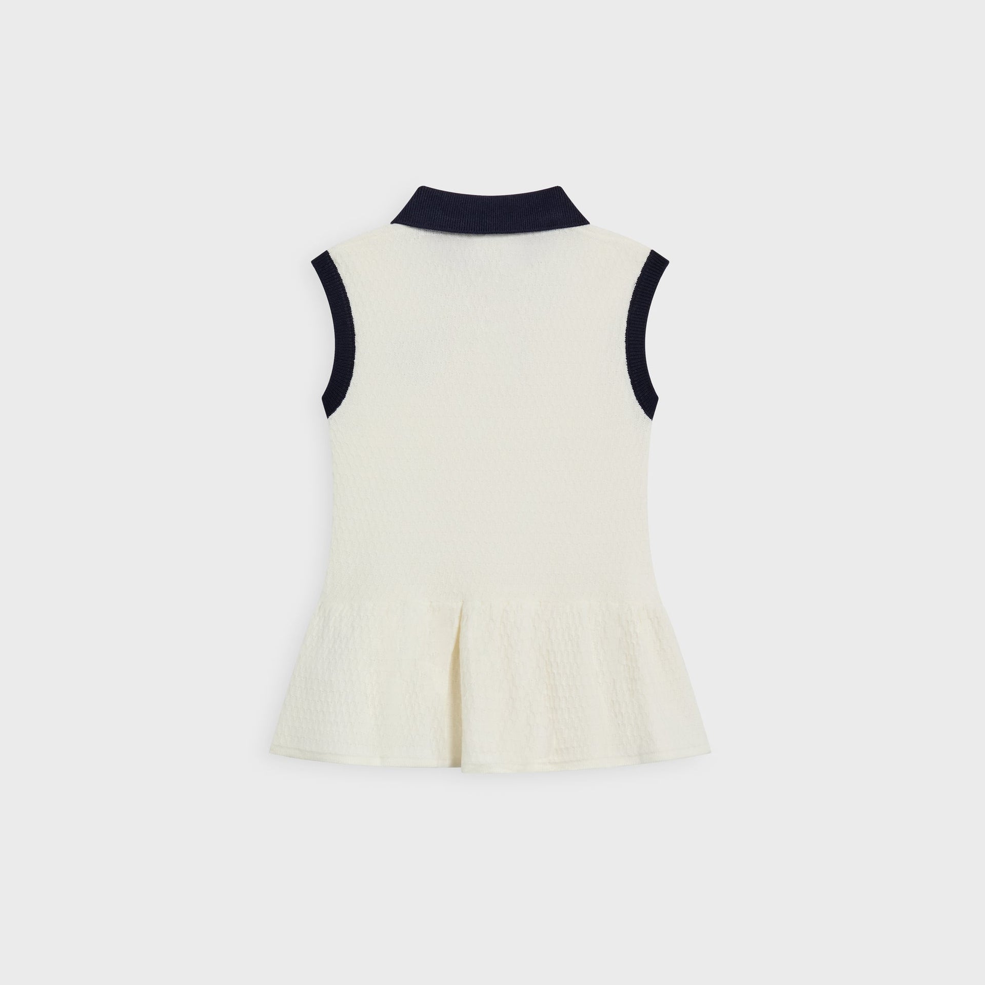 Kith Baby Knit Teagan Polo Dress in ivory, back flat lay showing navy collar, sleeveless armholes and peplum hem
