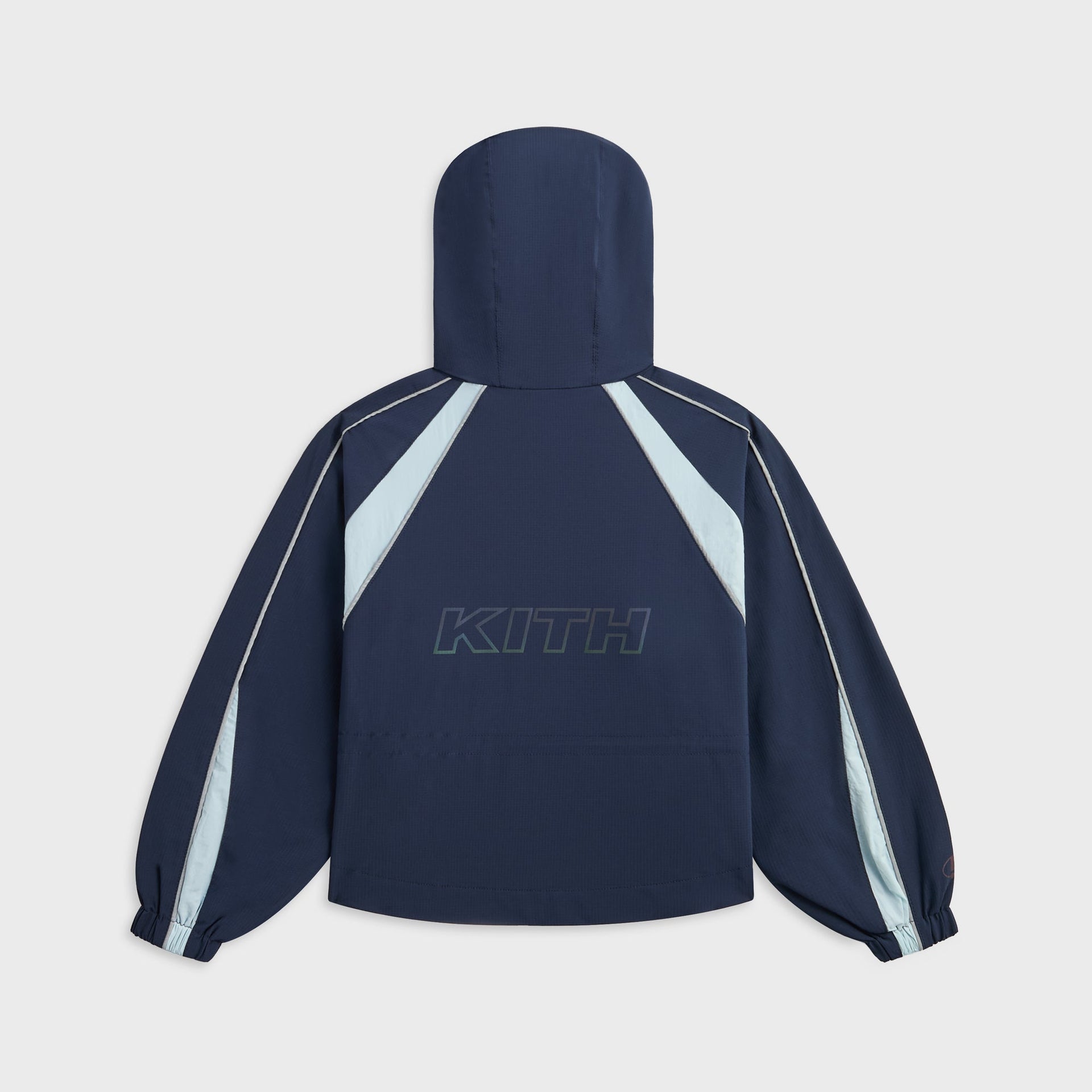Kith Kids Lora Windbreaker Jacket in navy, back view with hood, light blue panels and KITH outline print