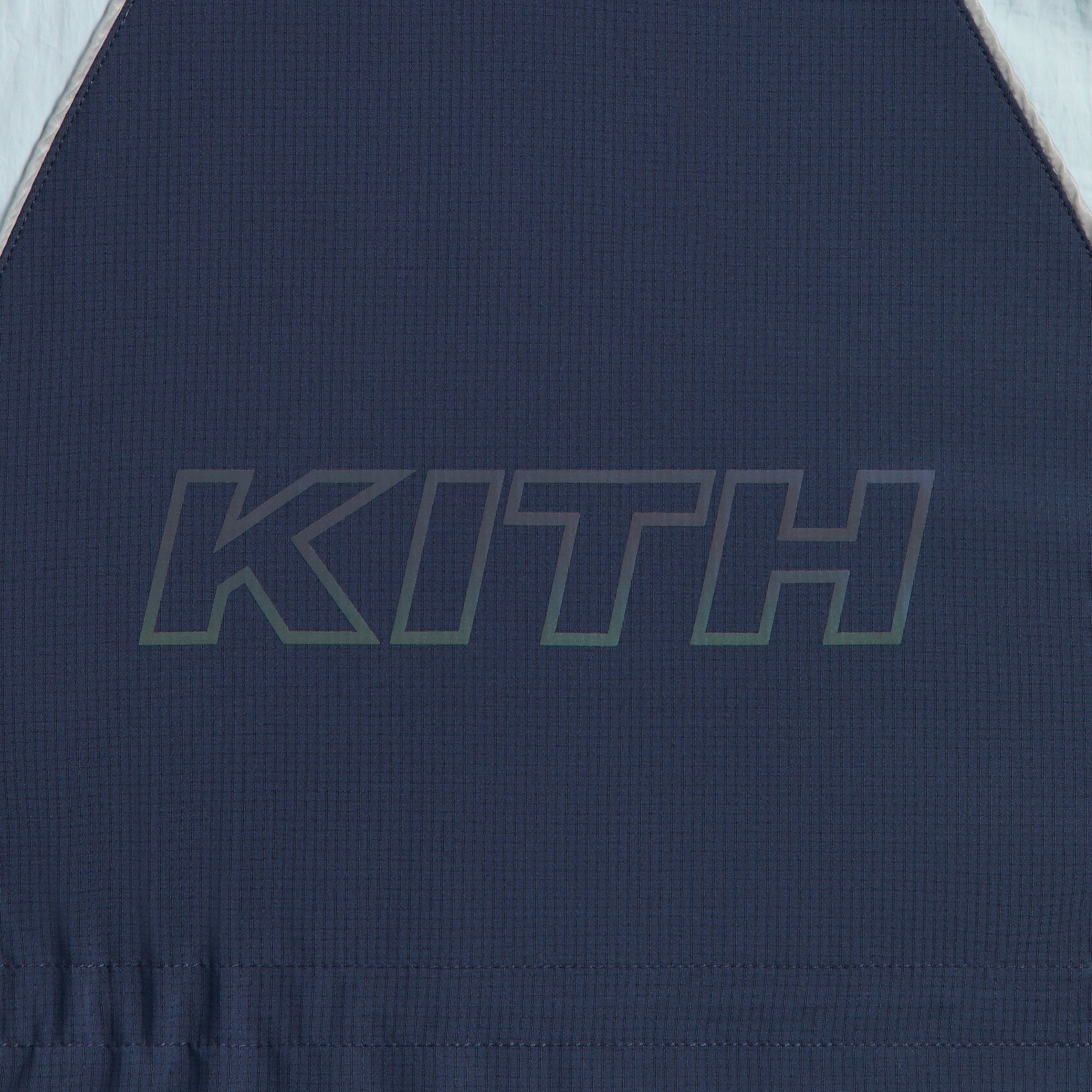 Kith Kids Lora Windbreaker Jacket close-up of tonal navy KITH outline print on back