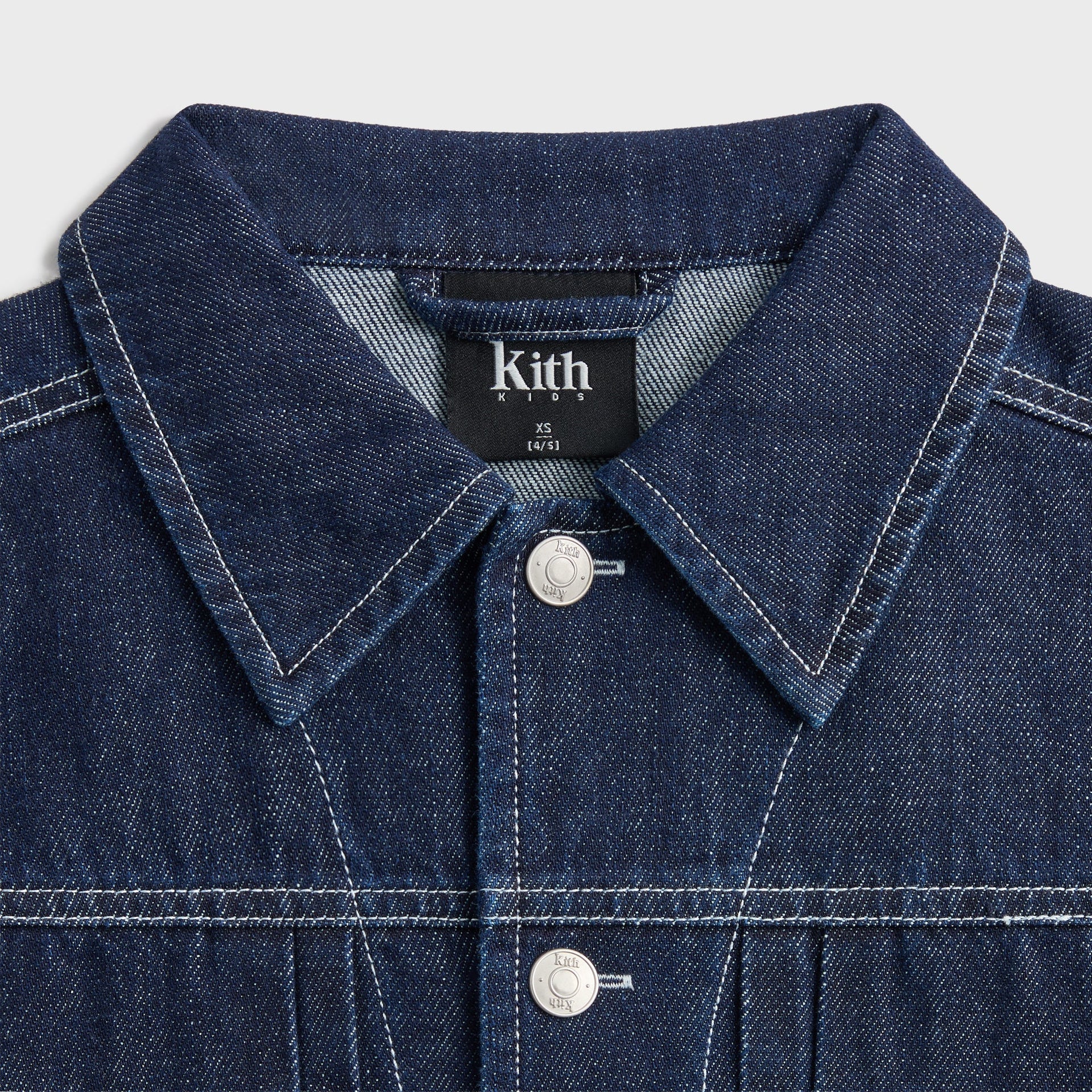Kith Kids Alonzo II Denim Jacket, close-up of collar with Kith Kids woven neck label and top button