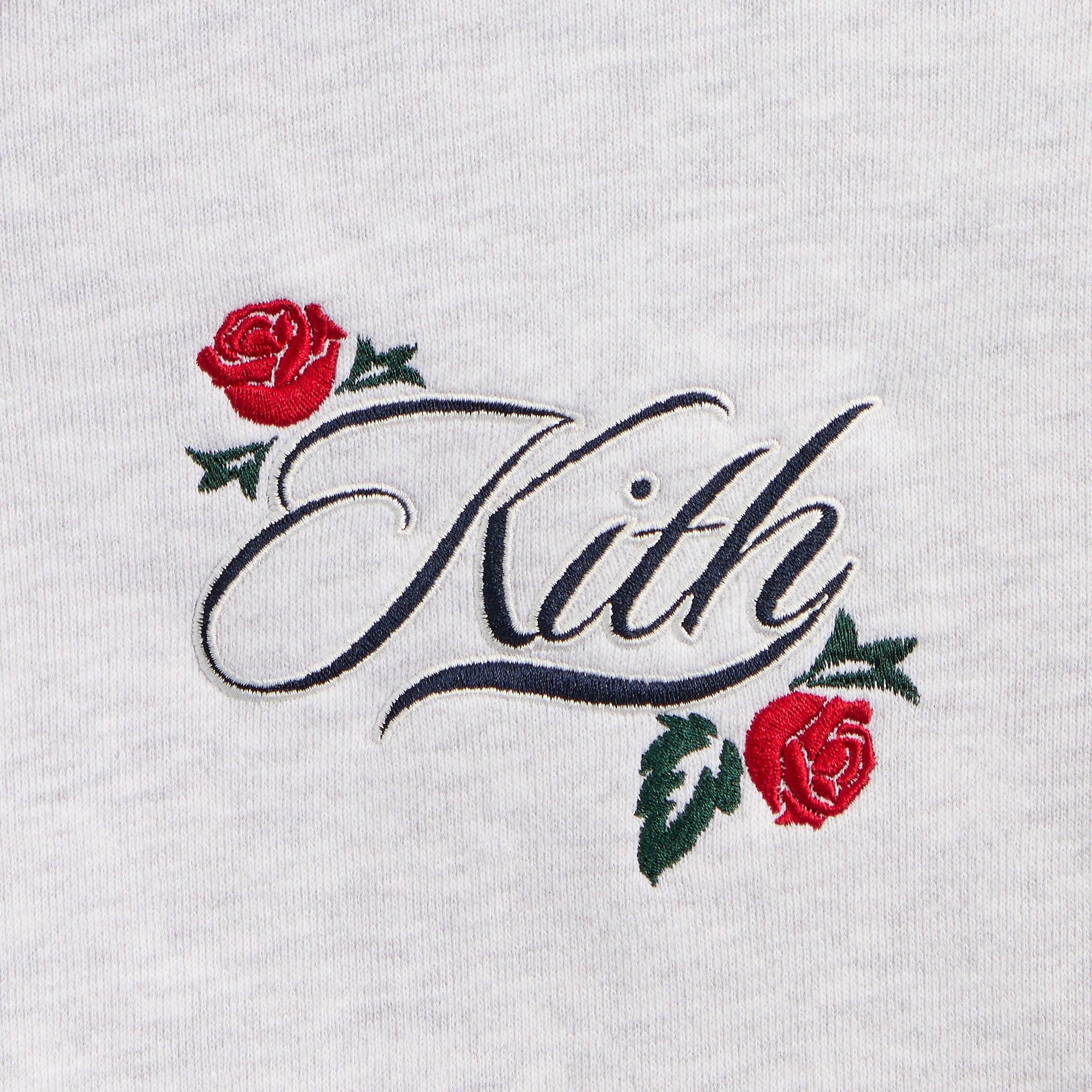 Kith Kids Wyona Fleece Bomber Jacket, close-up of navy Kith script and red rose chest embroidery