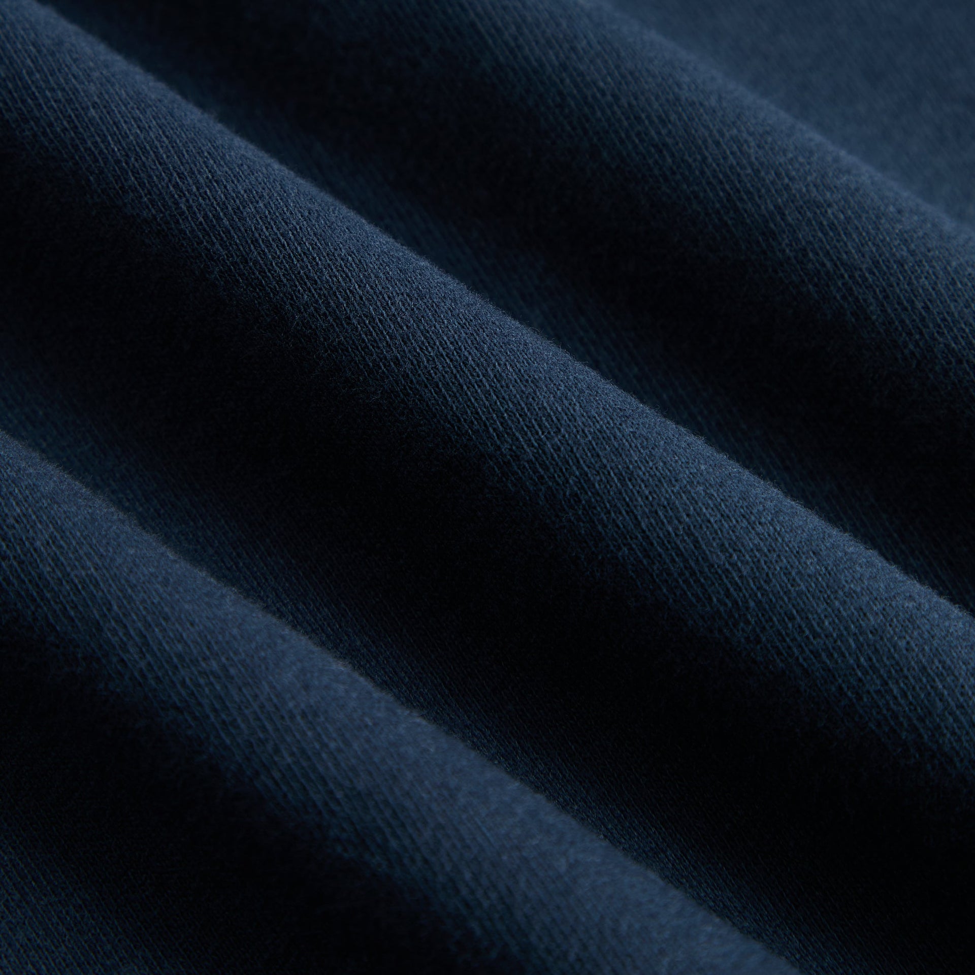 Kith Kids Wyona Bomber Jacket in Nocturnal navy, close-up of soft fleece fabric texture