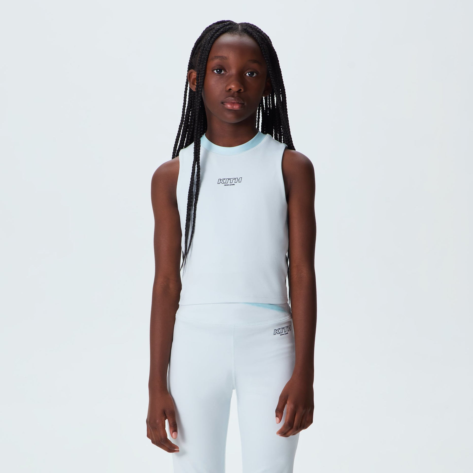 Girl wearing Kith Kids Active Tiana III Tank in Surry pale blue with matching leggings, front on-model view