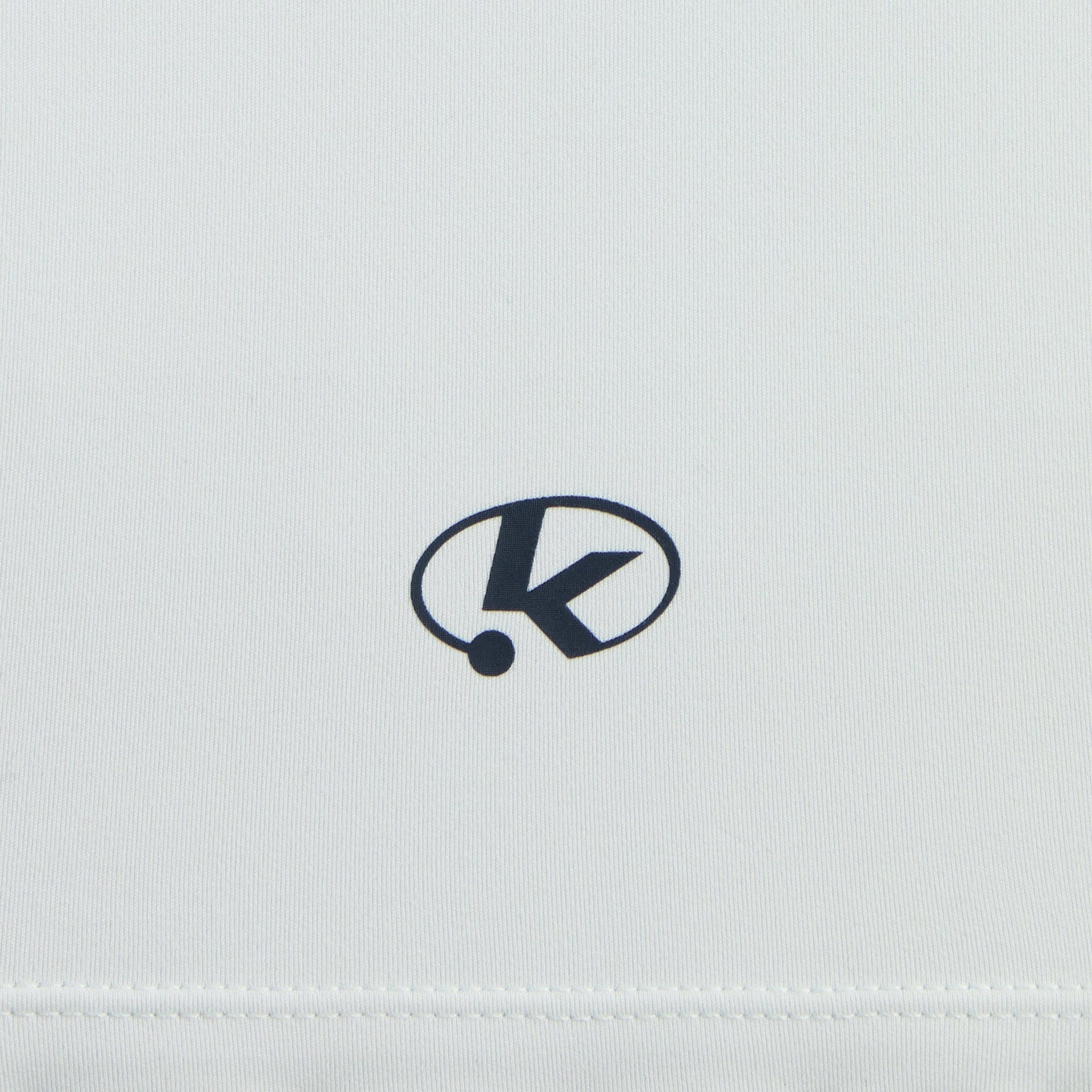 Close-up of navy K oval logo on back hem of Surry pale blue Kith Kids Tiana III Tank