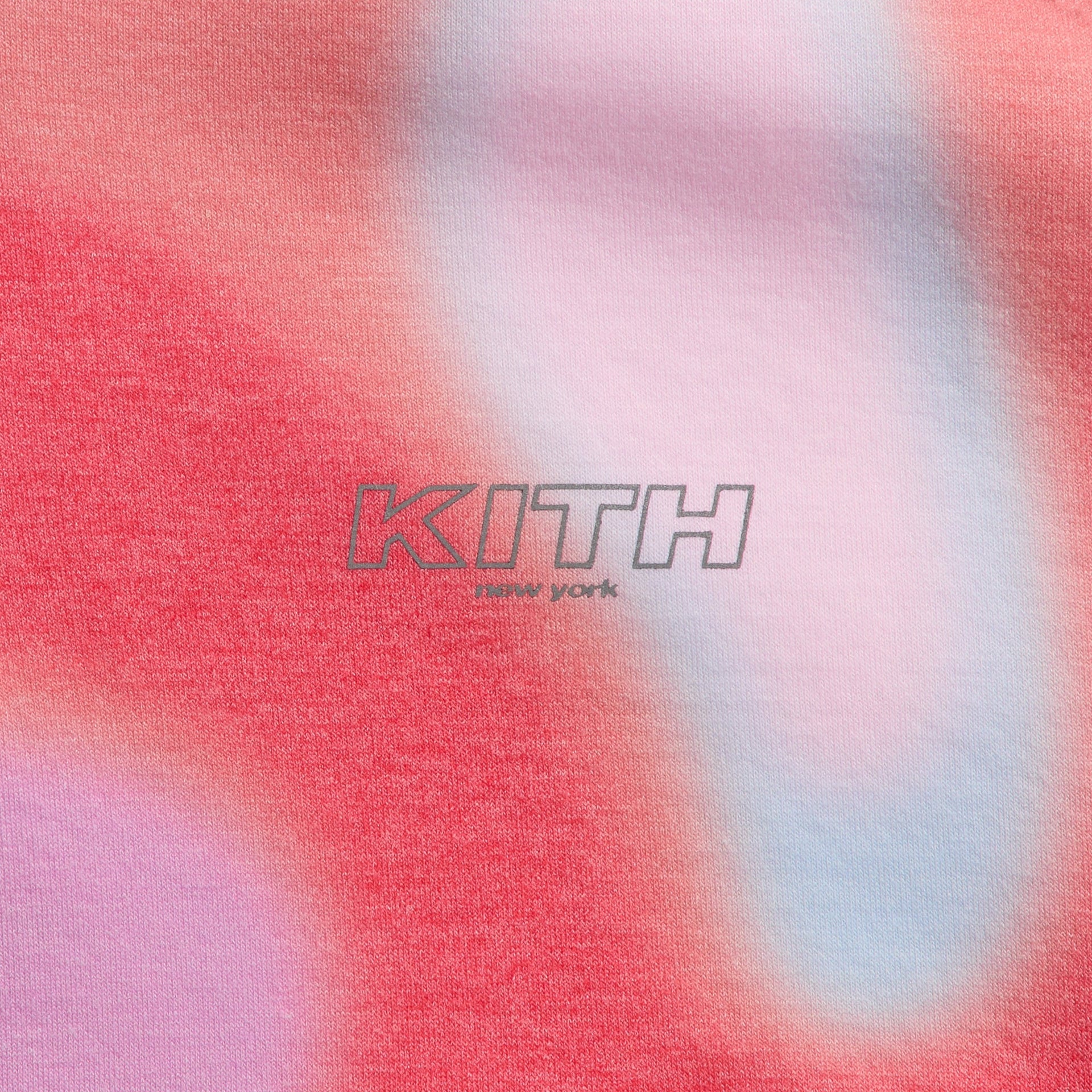 Close-up of KITH New York chest logo on Tempo swirl print Kith Kids Adinah Quarter Zip hoodie