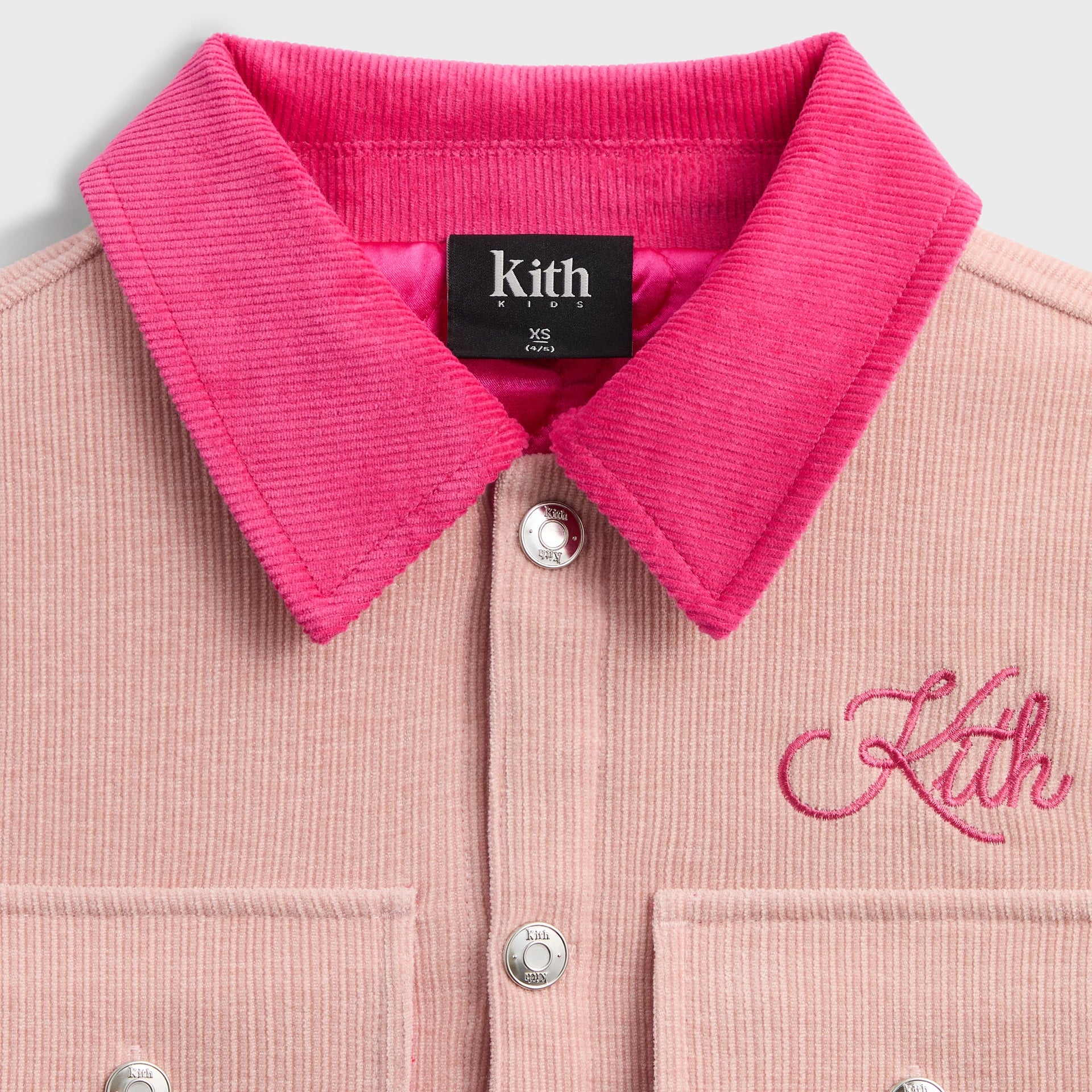 Kith Kids Cropped Ora Shacket close-up of contrasting hot pink corduroy collar, Kith Kids label and pink Kith script embroidery
