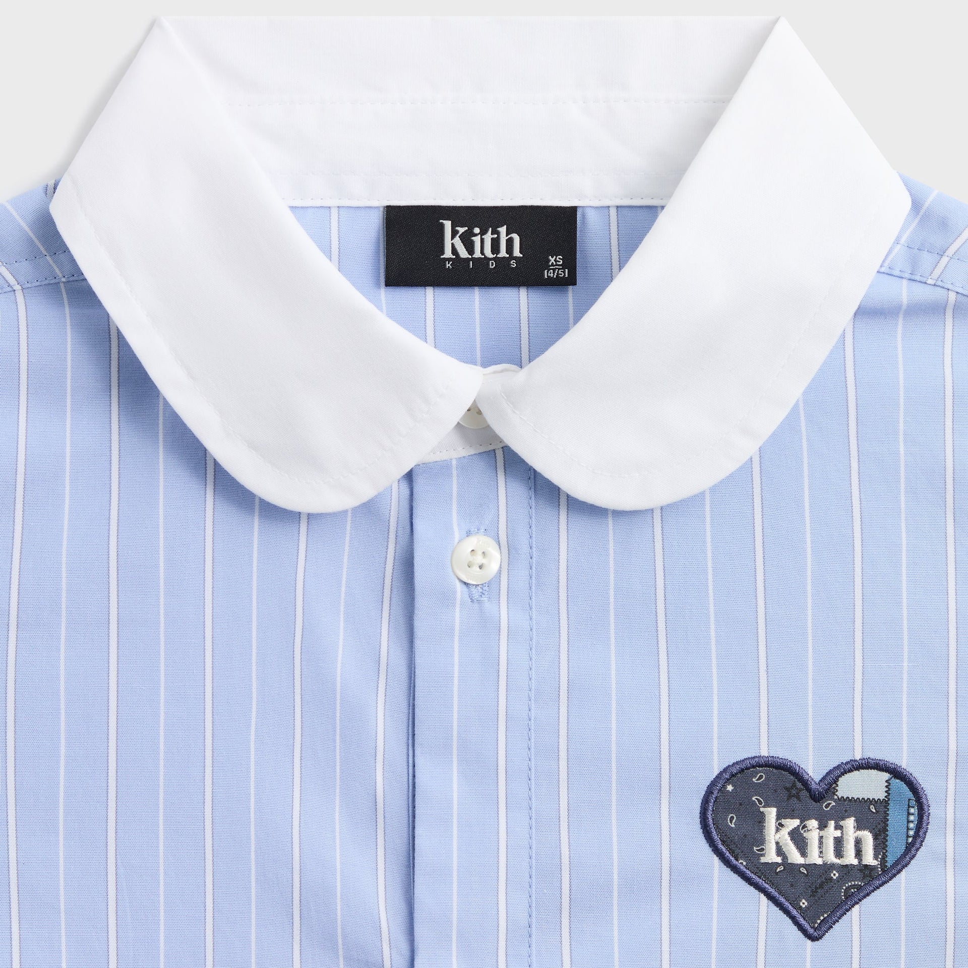 Kith Kids Cropped Apollo Shirt close-up of white rounded collar and navy heart Kith patch