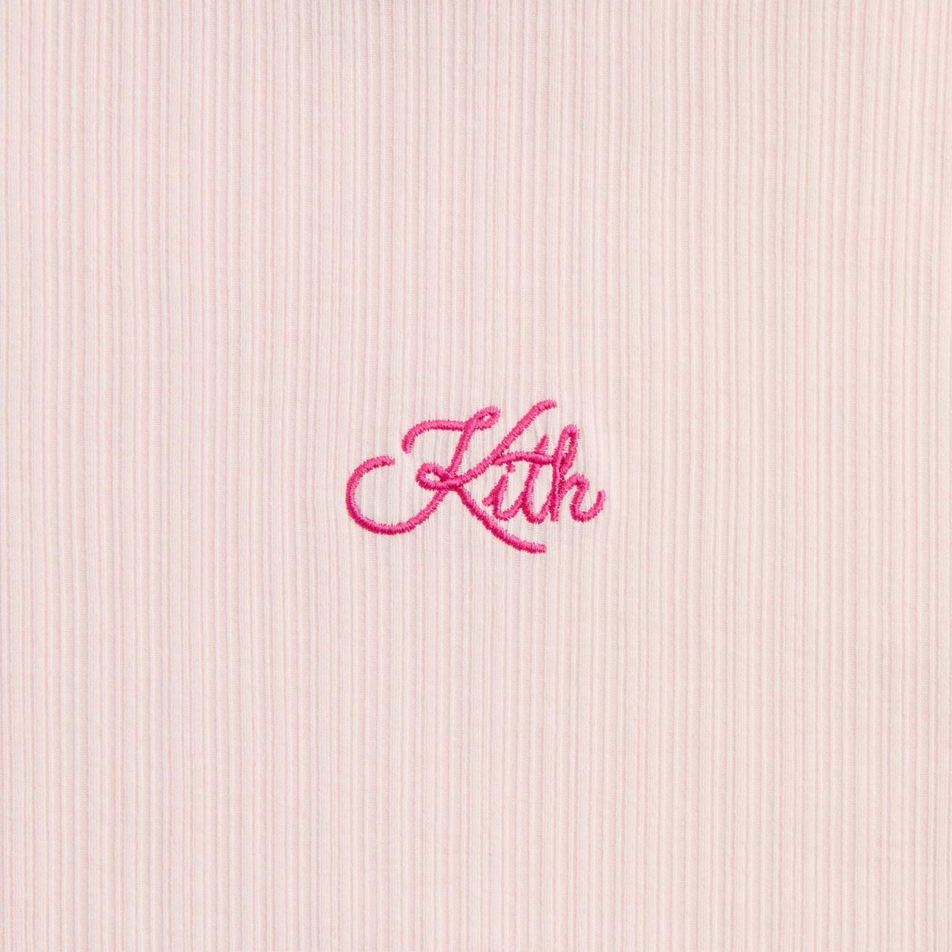 Kith Kids Mulberry Turtleneck, close-up of pink Kith script embroidery on ribbed knit