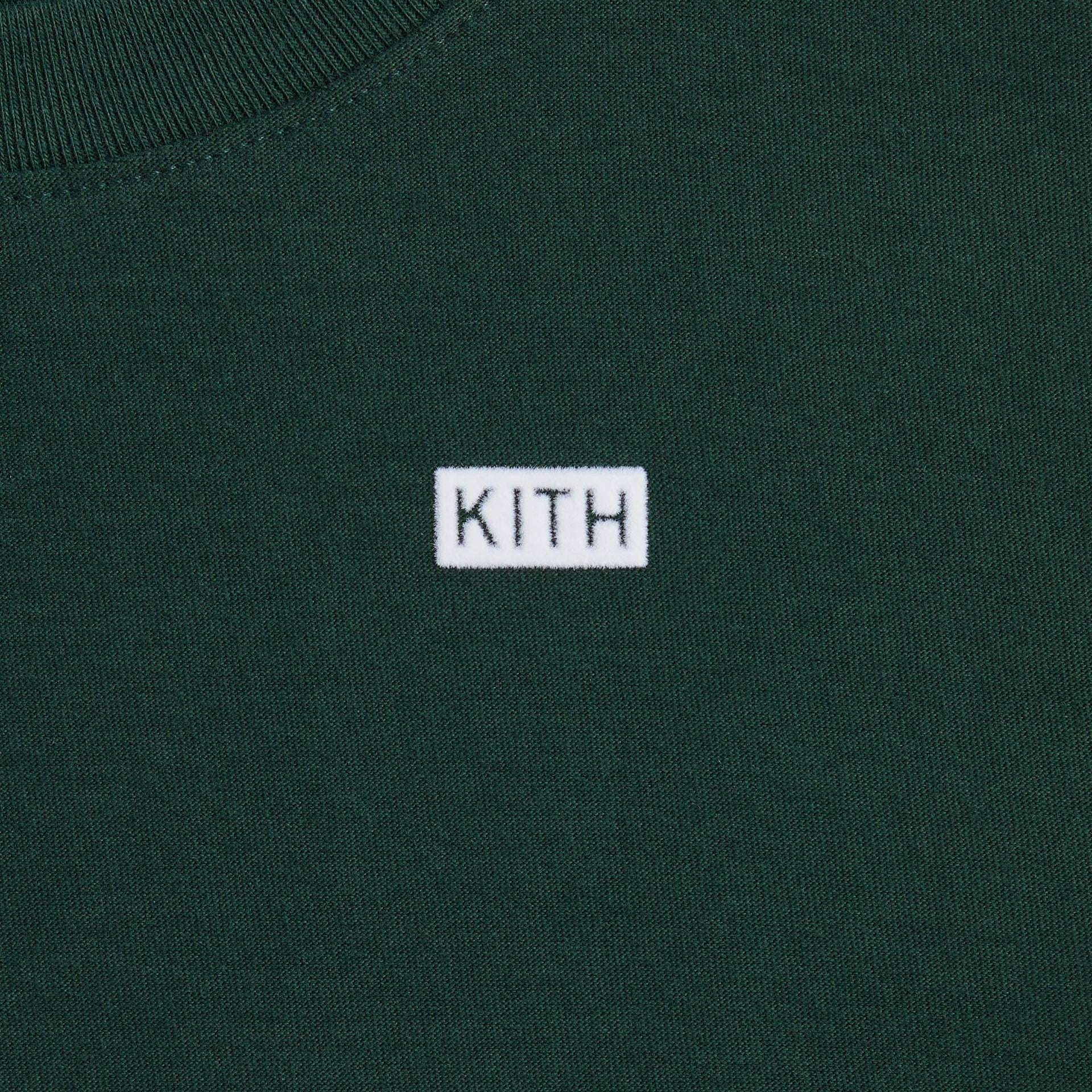 Kith Kids Long Sleeve LAX Tee, close-up of white Kith woven label on forest green fabric