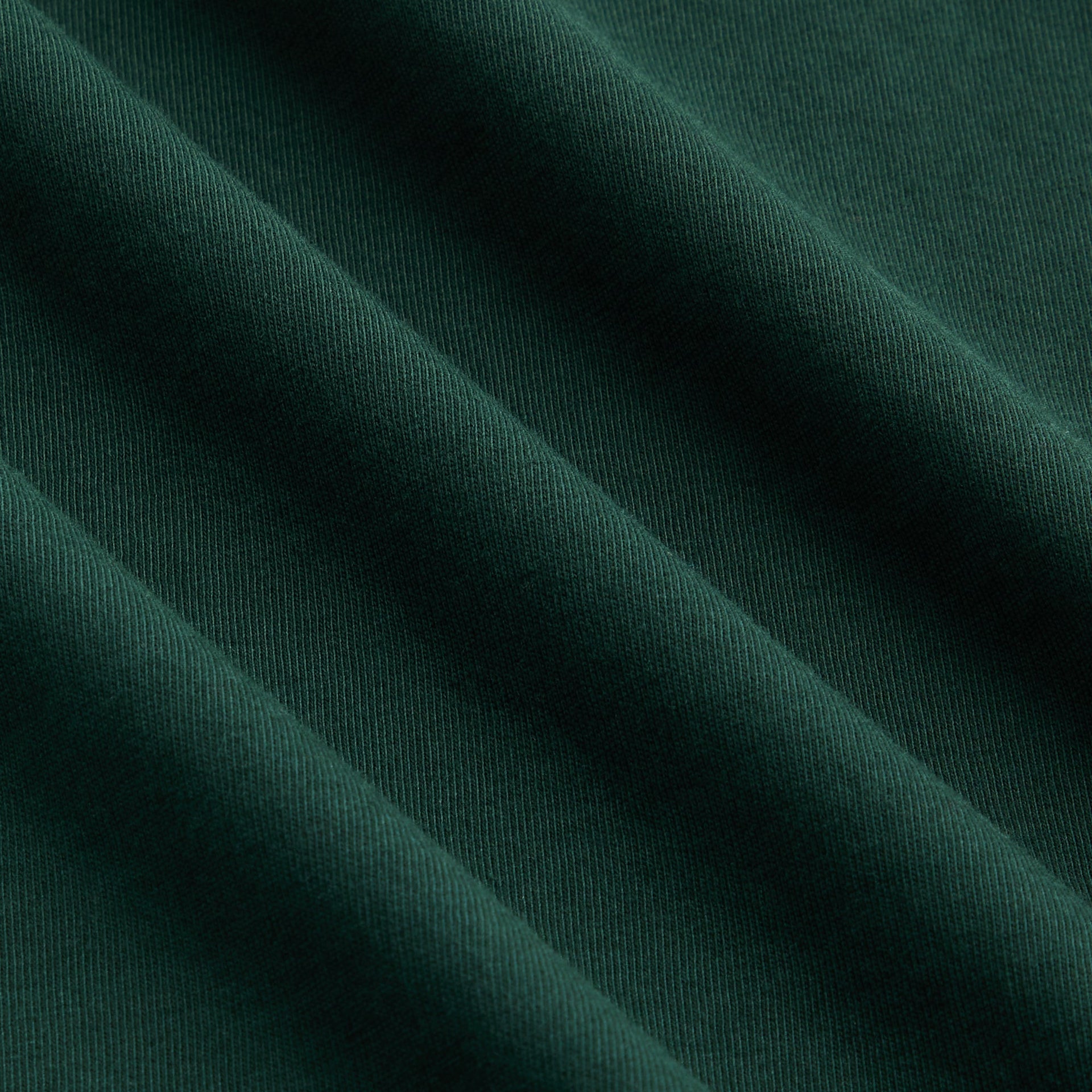 Kith Kids Long Sleeve LAX Tee, close-up of forest green cotton fabric texture