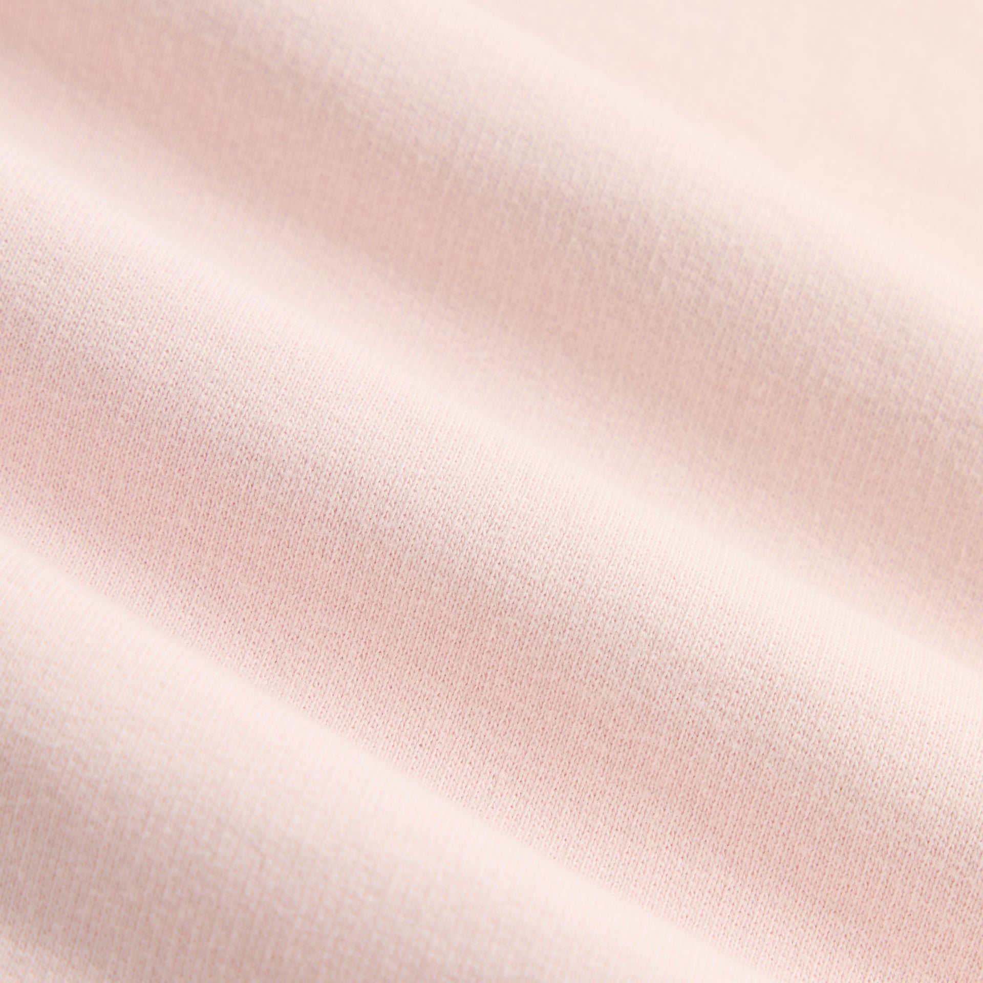 Close-up of soft Bloom pink cotton jersey fabric on Kith Kids Classic Mott Tee
