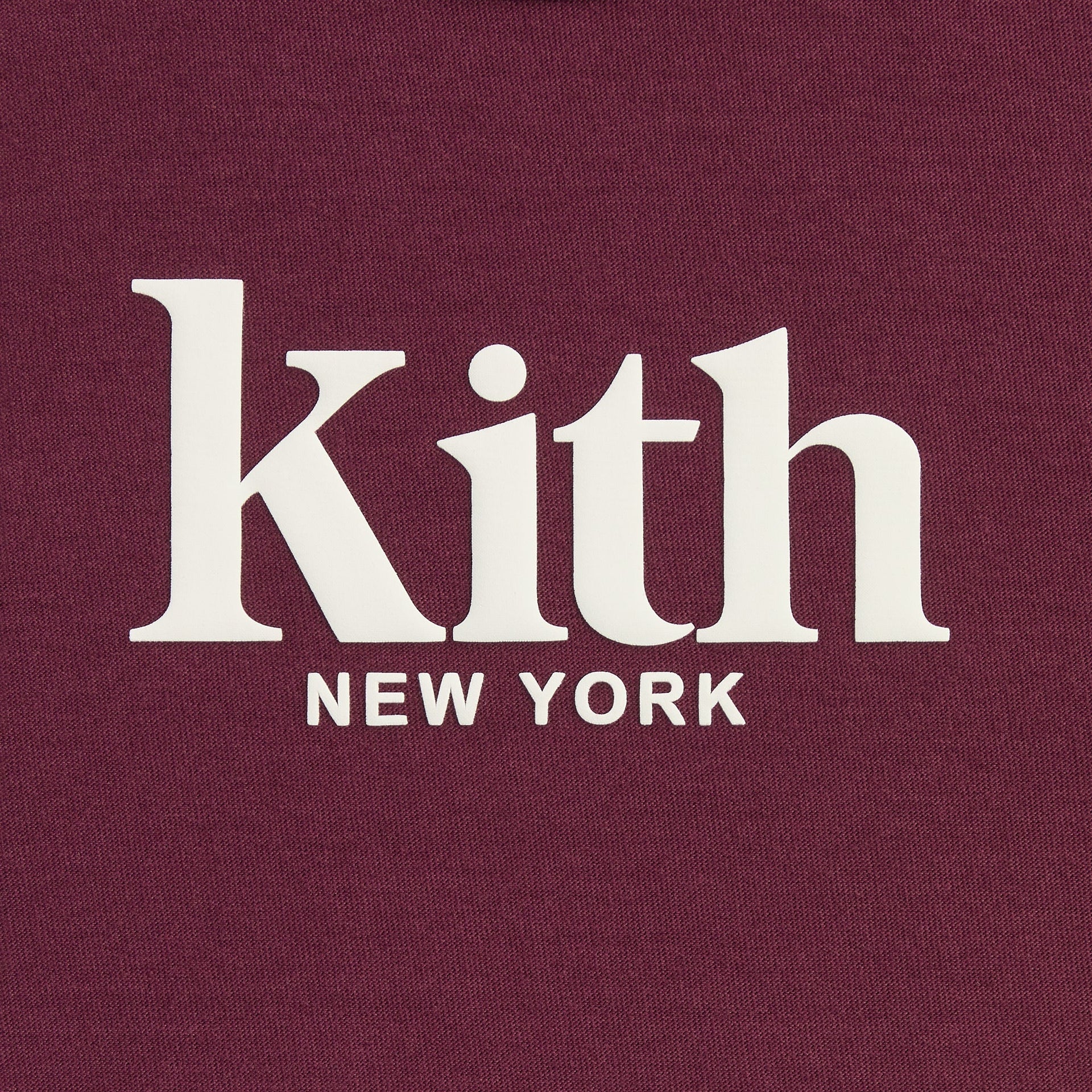 Kith Kids Classic Mott Tee close-up of cream Kith New York logo print on burgundy