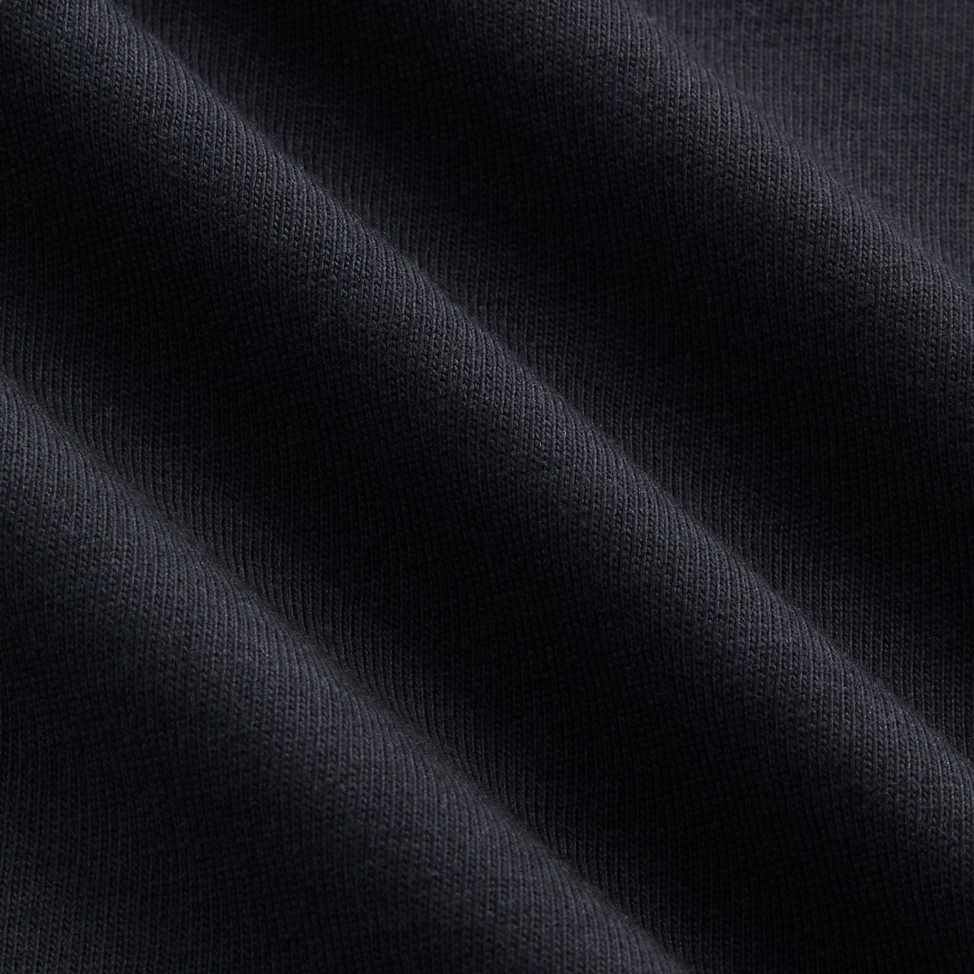 Kith Kids Vintage Coyote Tee fabric close-up of washed black cotton jersey