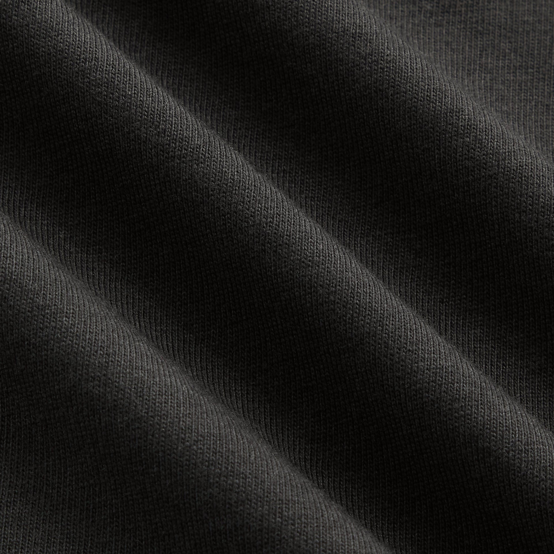 Close-up of washed Black cotton jersey fabric on Kith Kids Vintage Eagle Tee