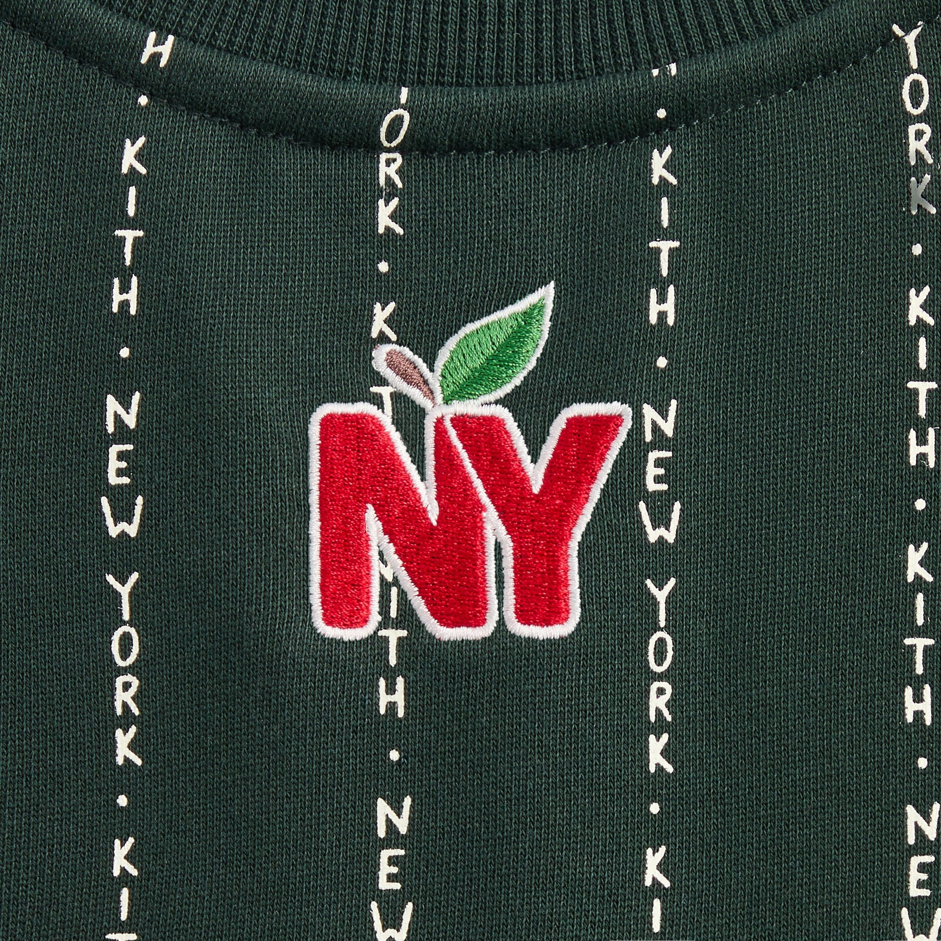 Kith Kids Quarter Zip Sweatshirt in green Stadium, close-up of red NY apple patch at back neck