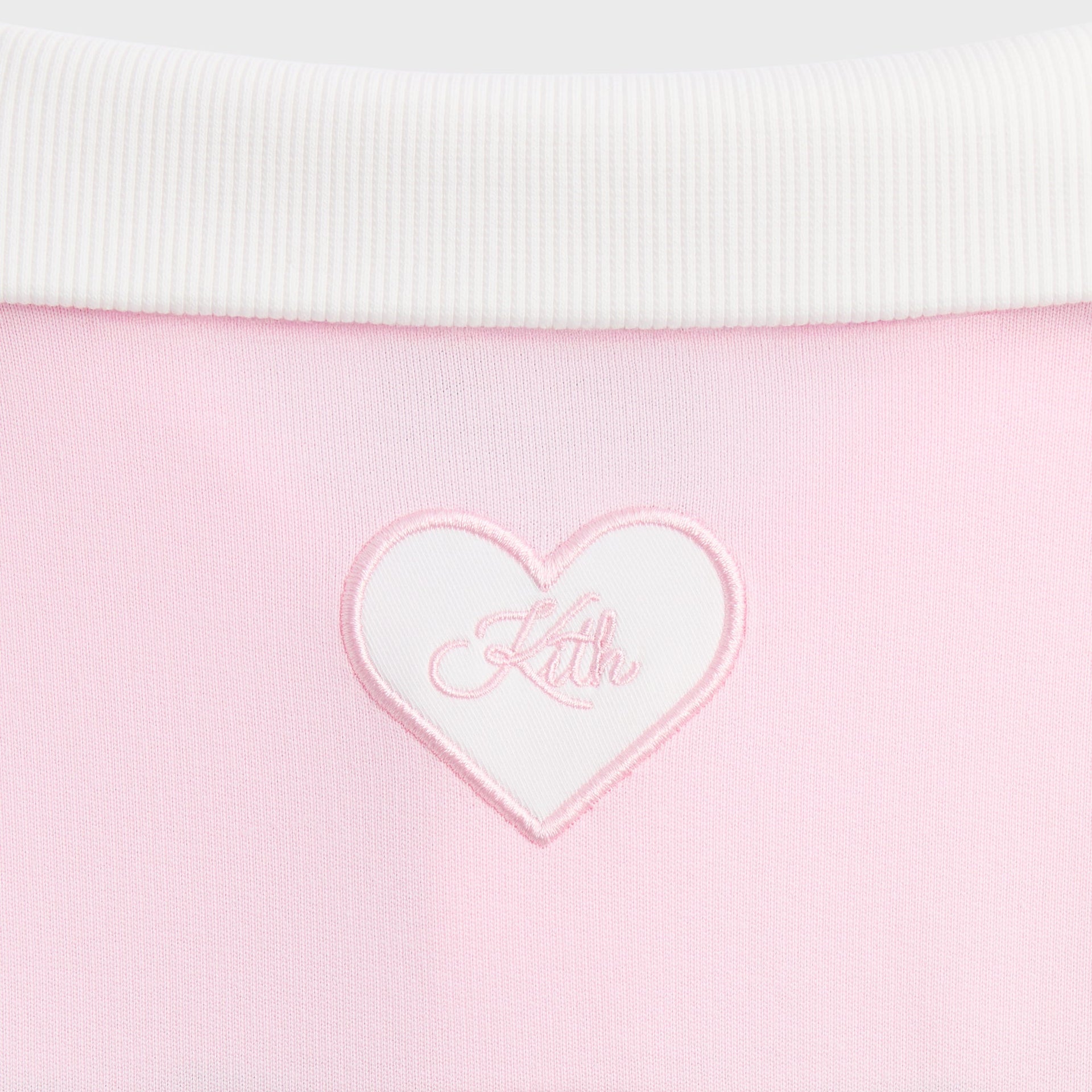 Kith Kids Blocked Cropped Rugby in pink Bloom, close-up of white ribbed collar and Kith heart patch