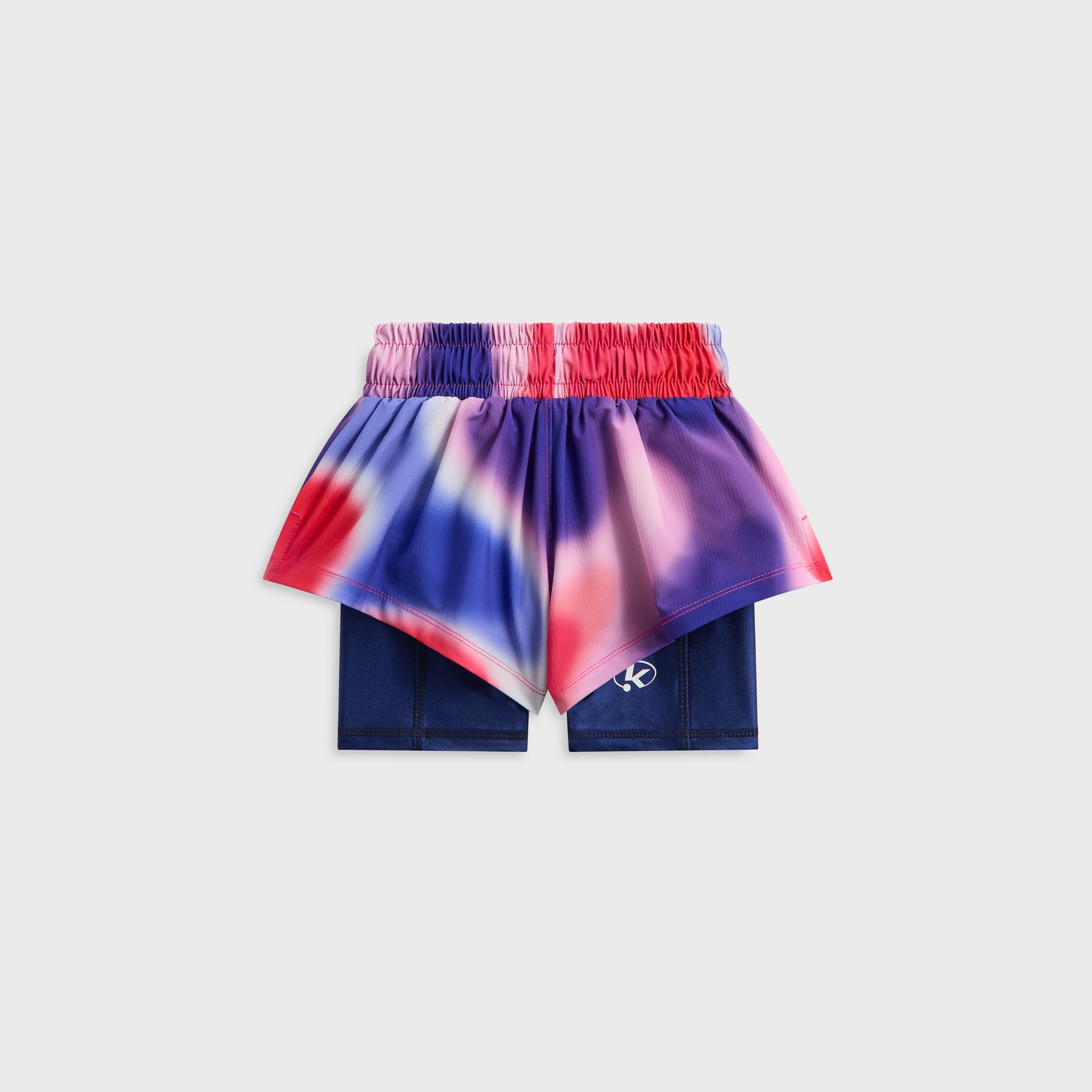 Kith Kids Printed Jazmyn II Active Short in aurora print, back flat lay with elastic waistband and navy liner showing oval K logo