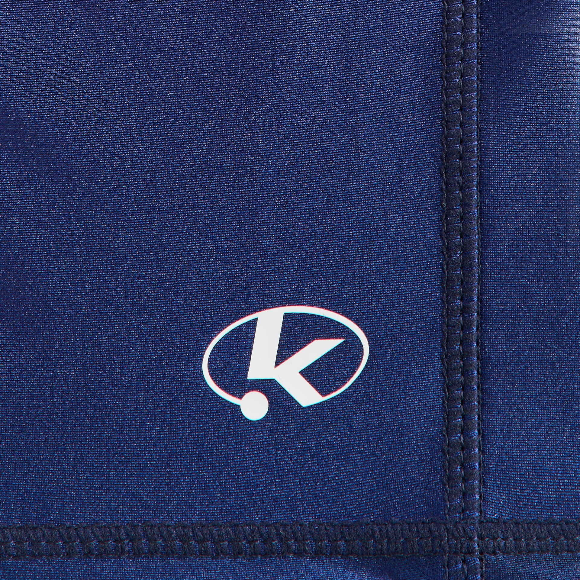 Kith Kids Printed Jazmyn II Active Short, close-up of navy compression liner with white oval K logo