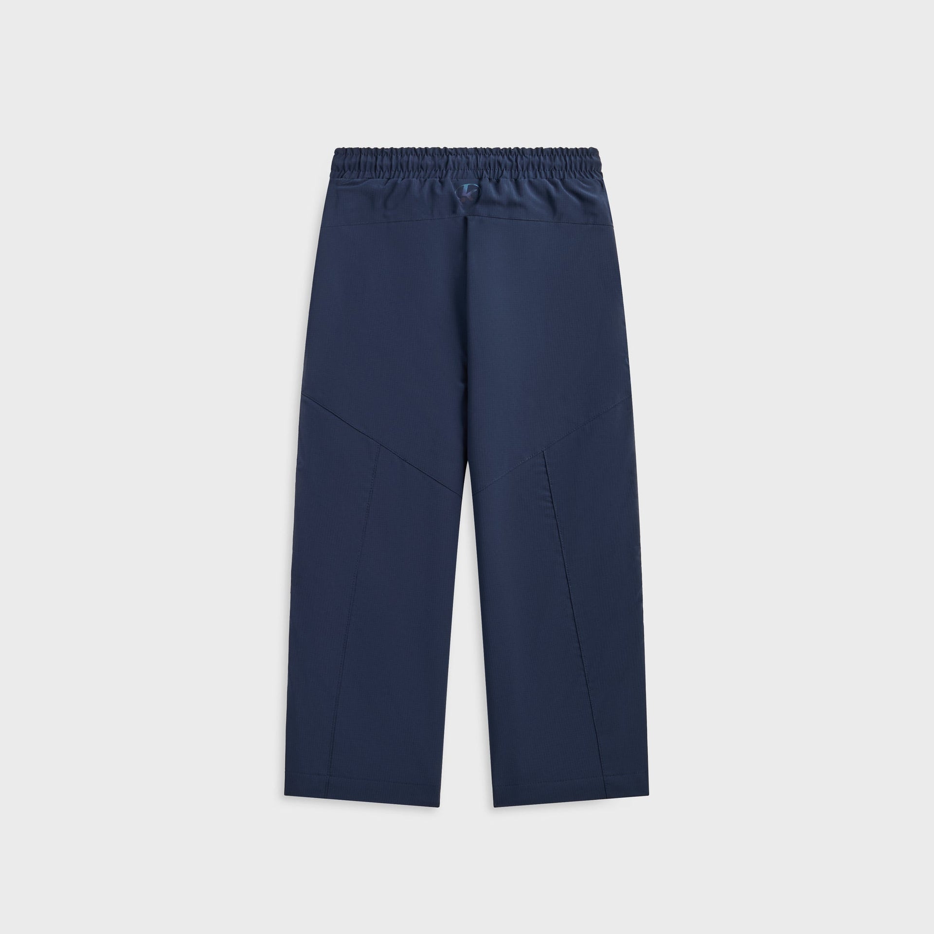 Kith Kids Lora Track Pant in navy, back flat lay showing elastic waistband and tonal Kith logo