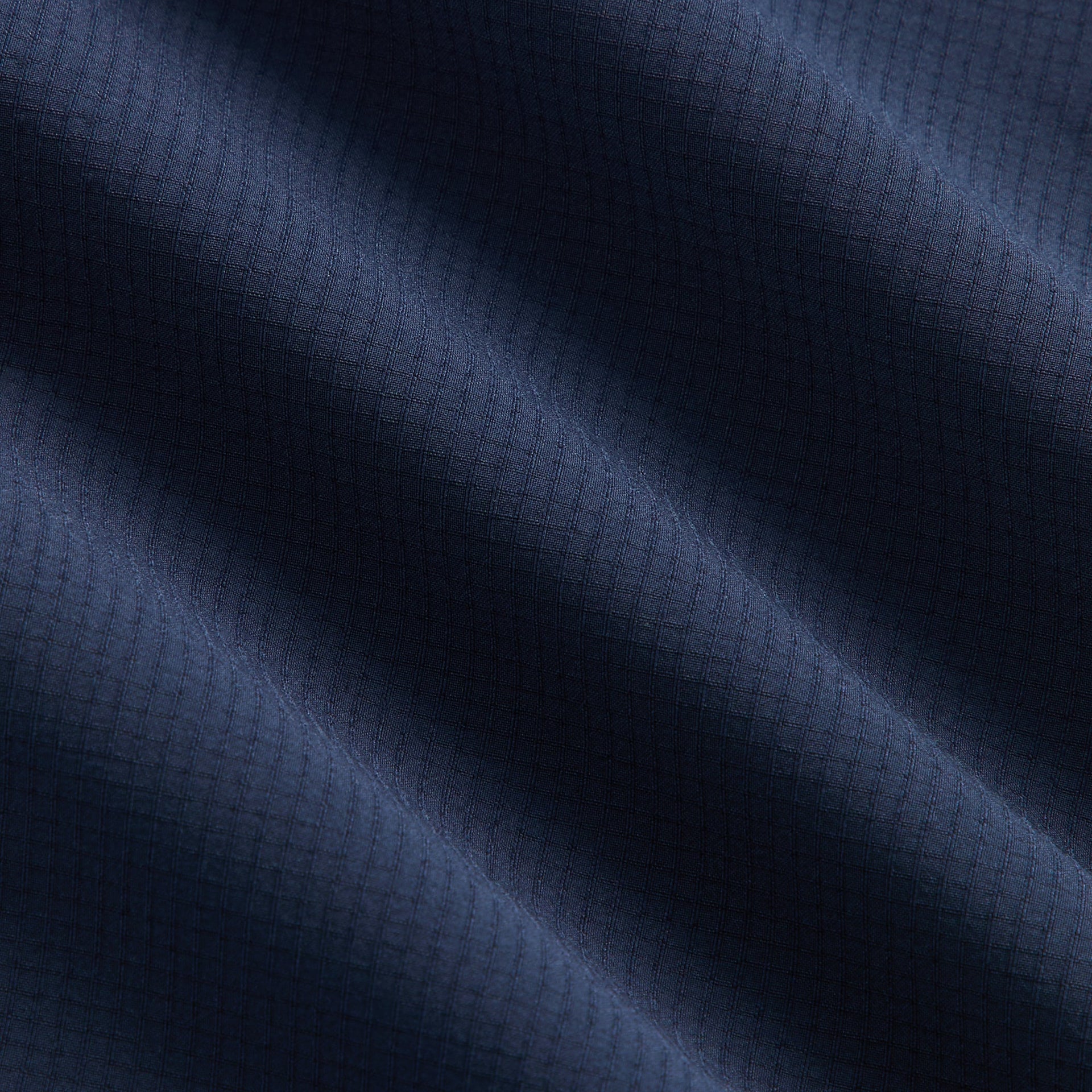Kith Kids Lora Track Pant, close-up of navy ripstop fabric texture