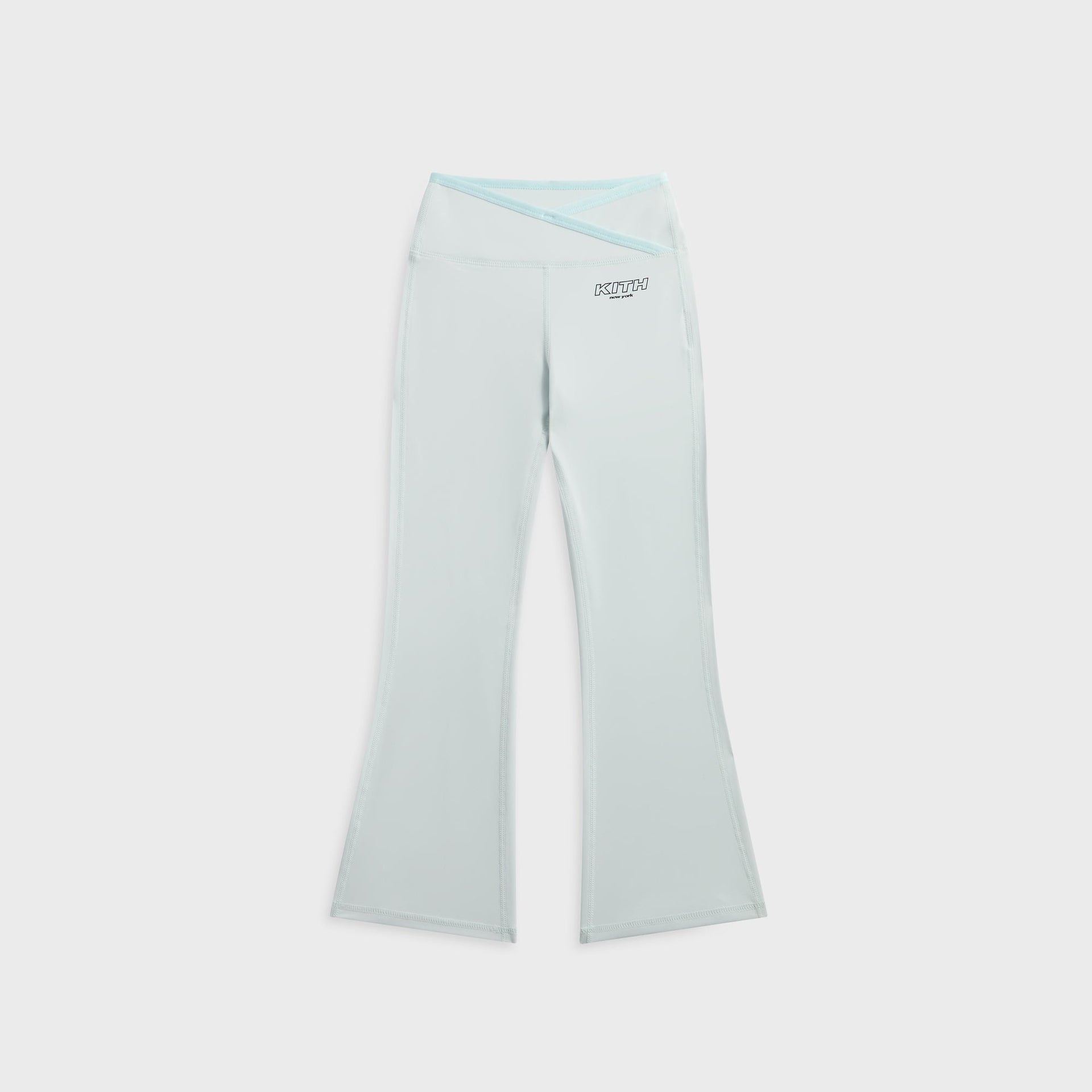 Kith Kids Active Jasina Flare Legging in pale mint, front flat lay with crossover waistband and KITH New York logo at hip