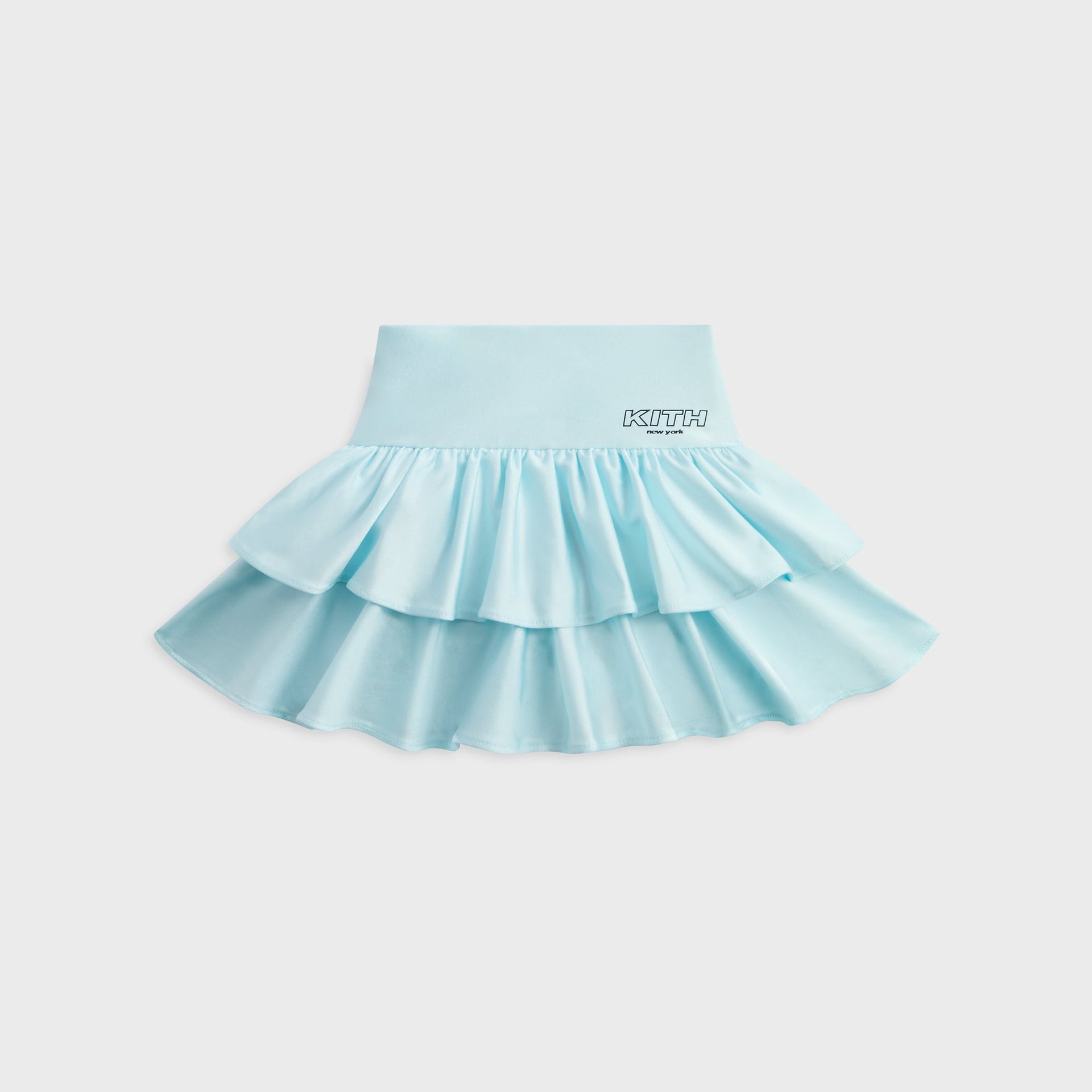 Kith Kids Active Savina Tiered Skort in light blue Surry, front flat lay with double ruffle tiers and KITH New York logo