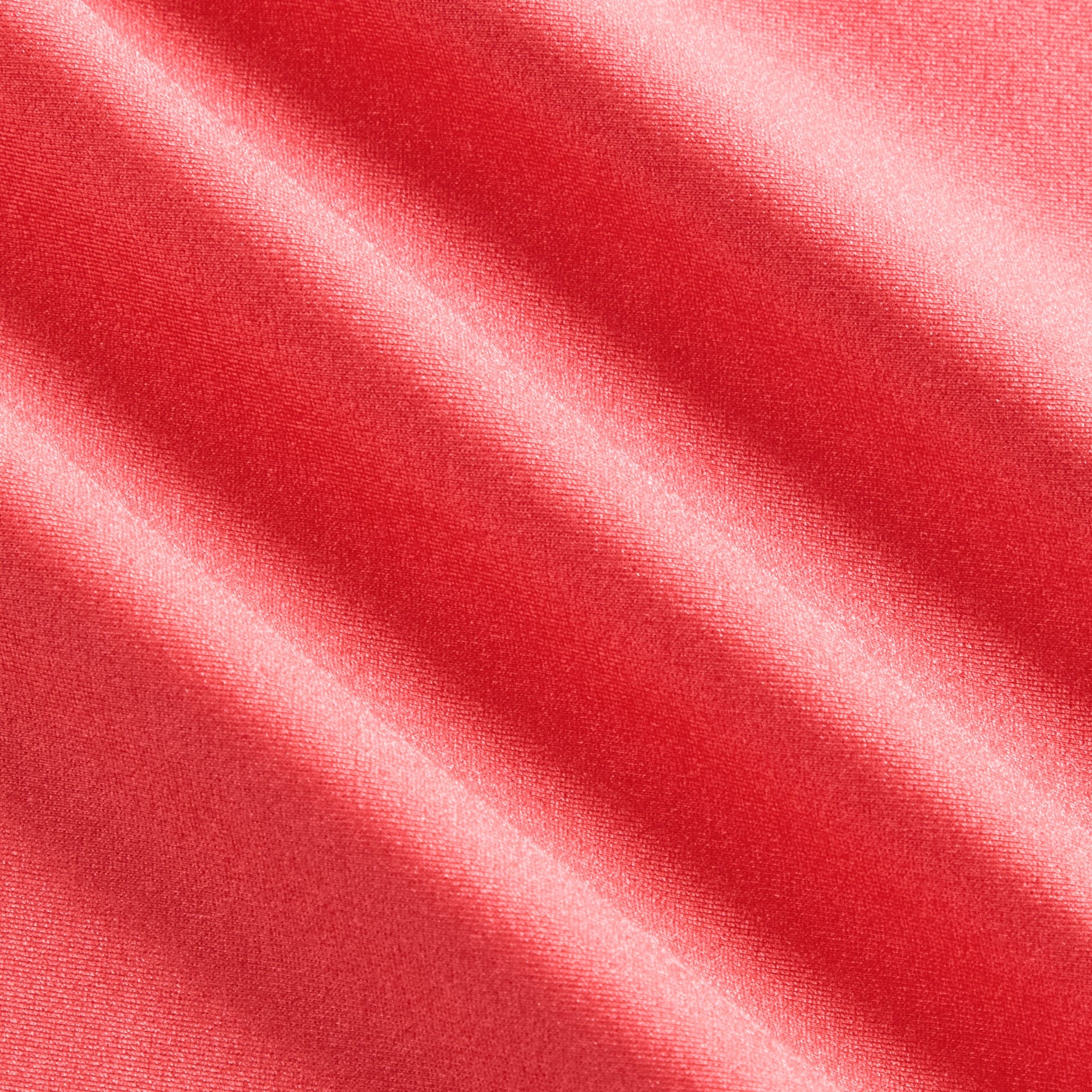 Kith Kids Active Ari Skort in carnation coral, macro close-up of soft velvet fabric texture