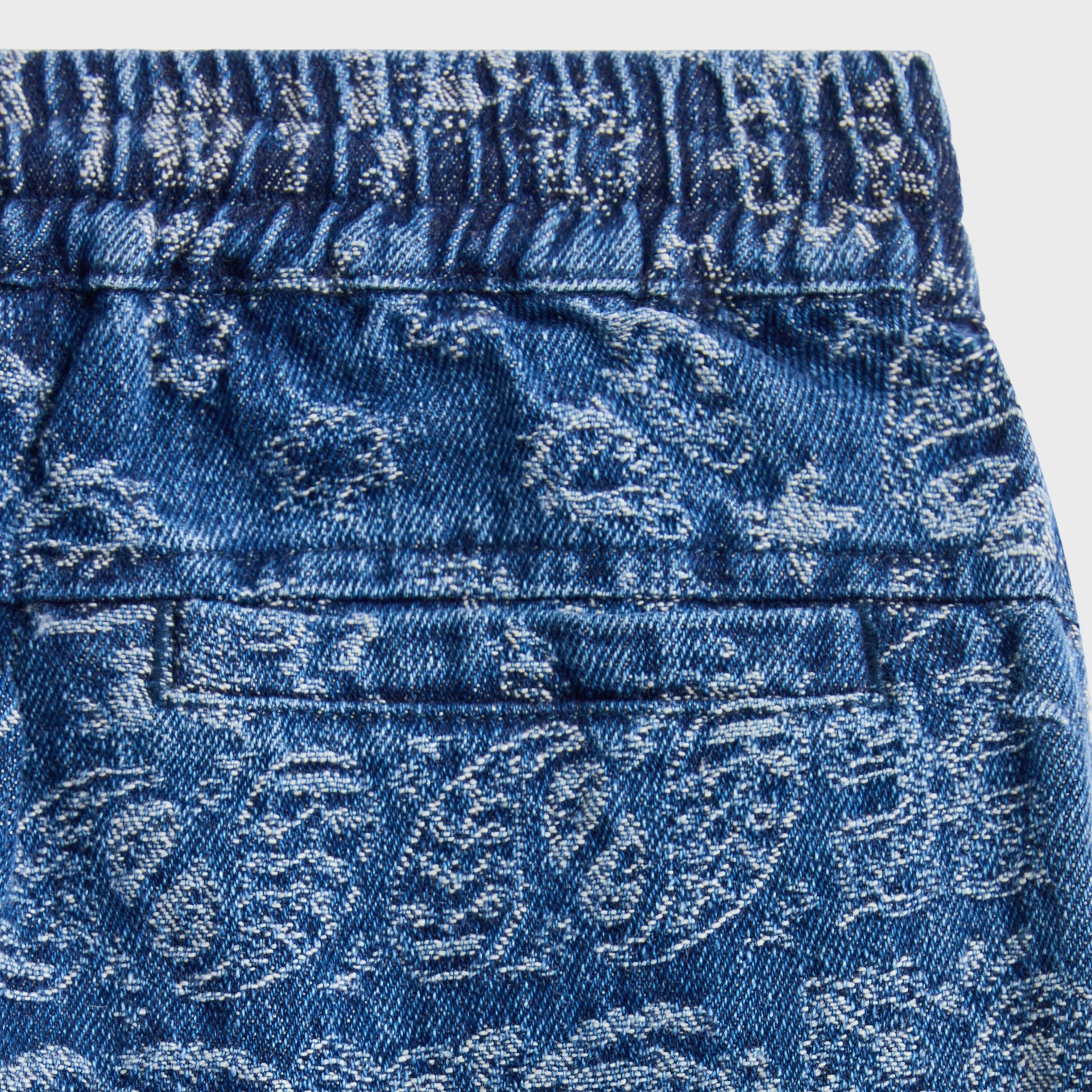 Kith Kids Paisley Owen Pant close-up of elastic waistband and welt pocket on indigo paisley denim