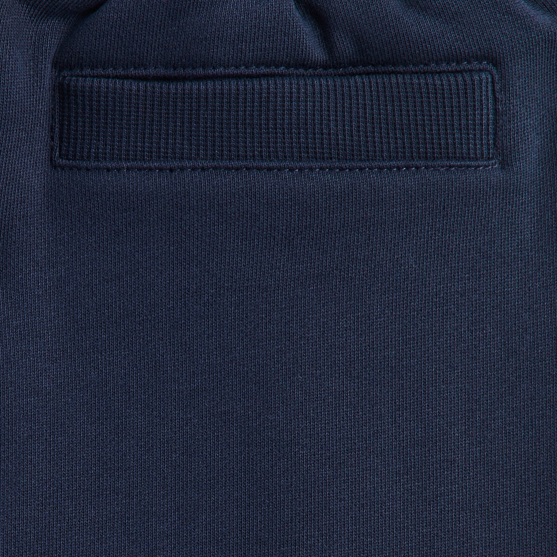 Kith Kids Williams Cargo Sweatpant detail of navy back welt pocket on tonal fleece