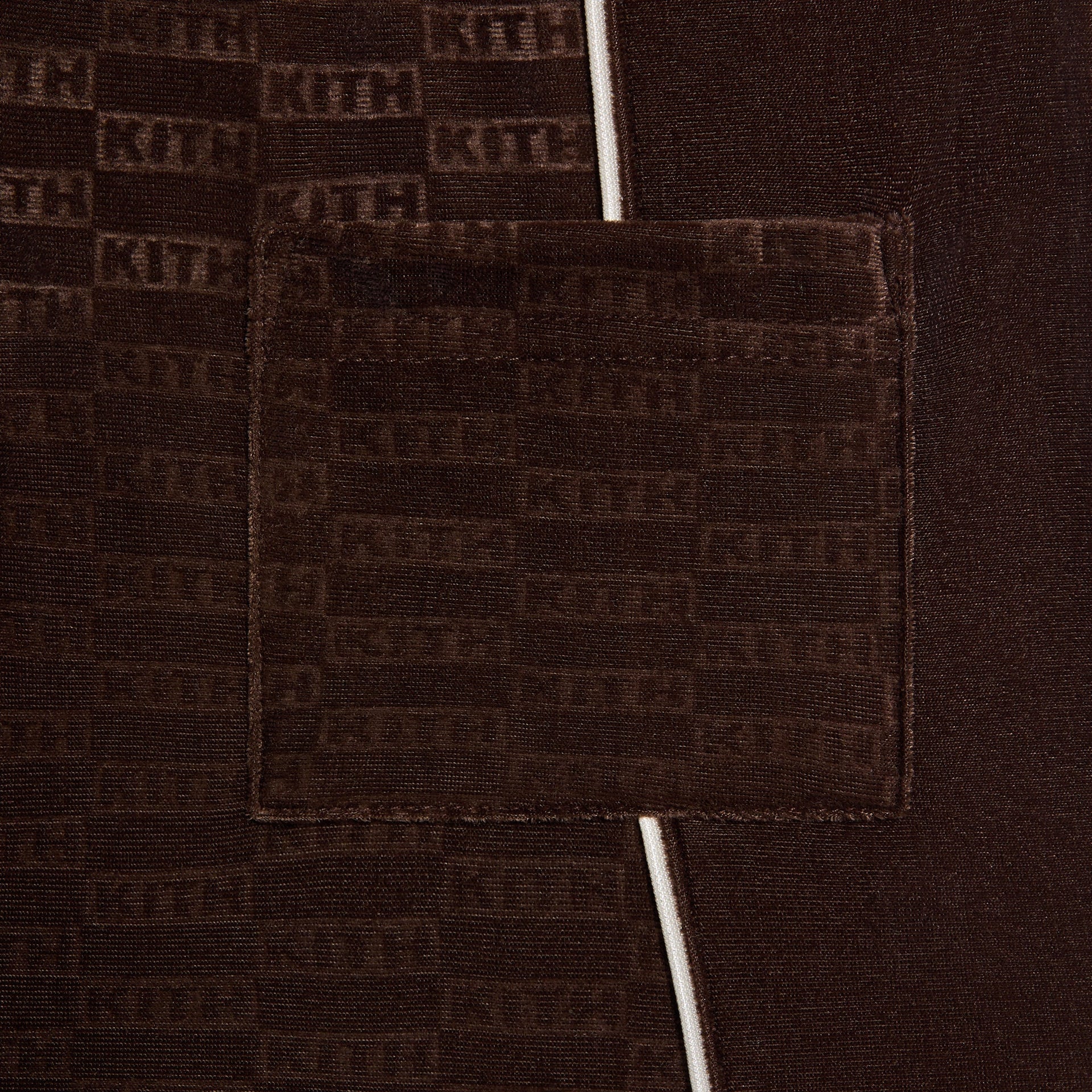 Kith Kids Monogram Velour Jordan Short in brown Kindling, close-up of back patch pocket on KITH monogram velour