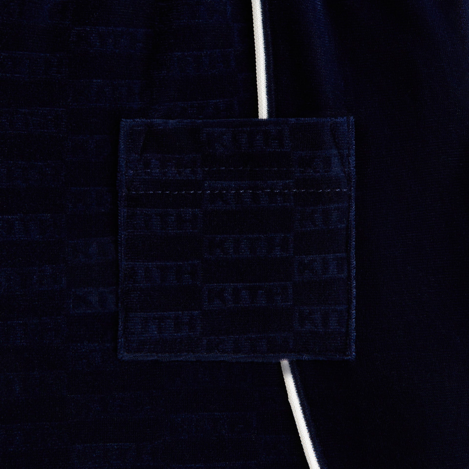 Kith Kids Monogram Velour Jordan Short in navy nocturnal, close-up of Kith monogram velour texture and back pocket