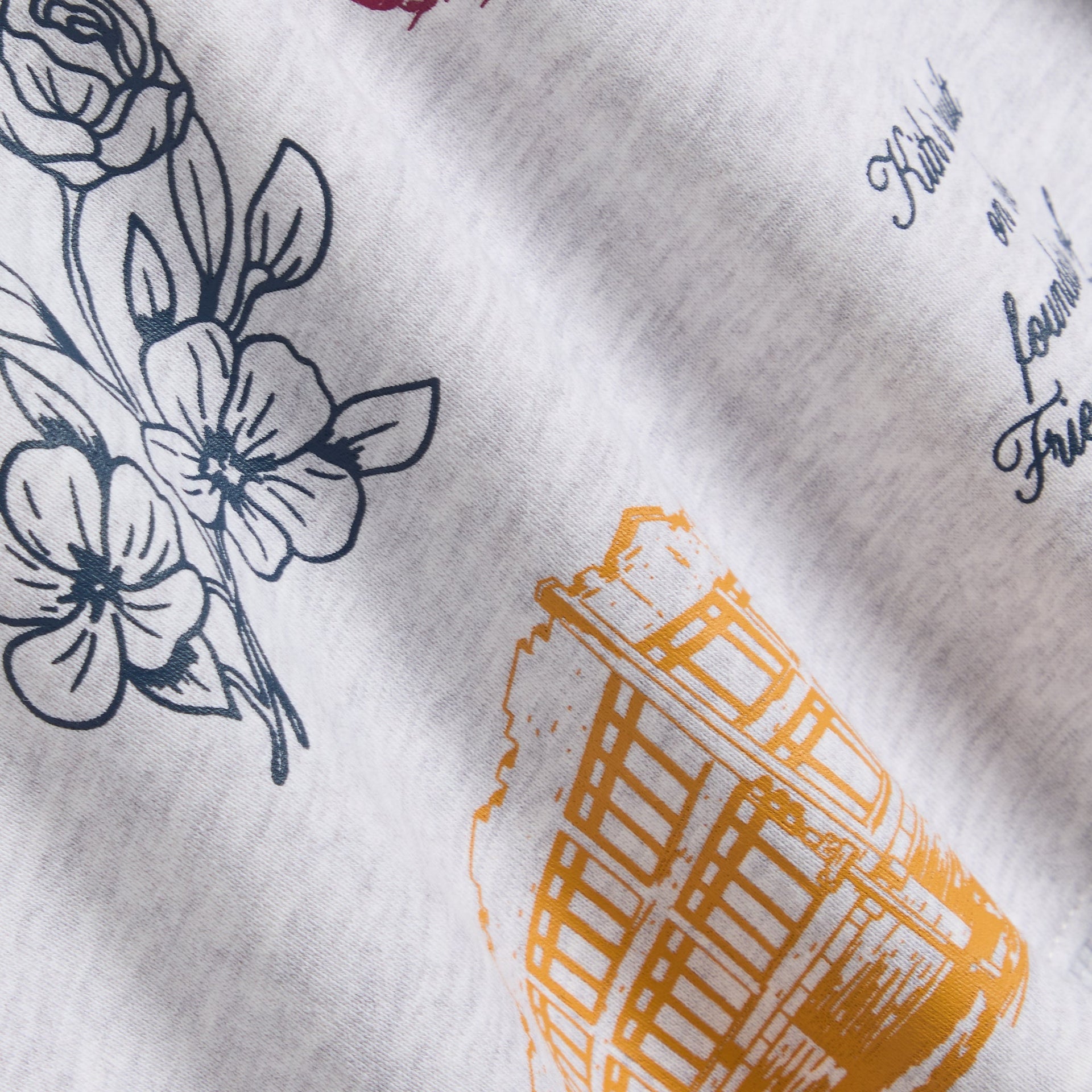 Kith Kids Logo Nelson Short in Light Heather Grey, close-up of floral and building graphic prints