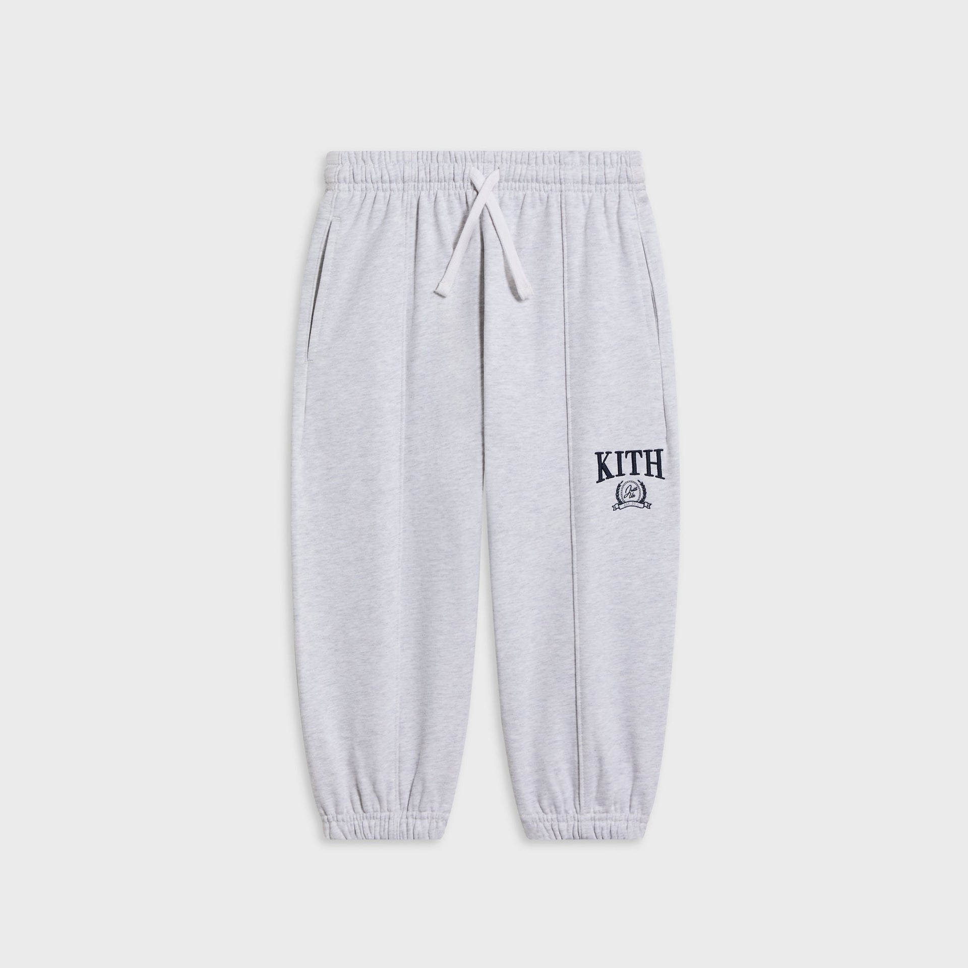 Kith Kids Collegiate Nelson sweatpant in light heather grey, flat lay with drawstring waist and navy KITH crest logo at the leg