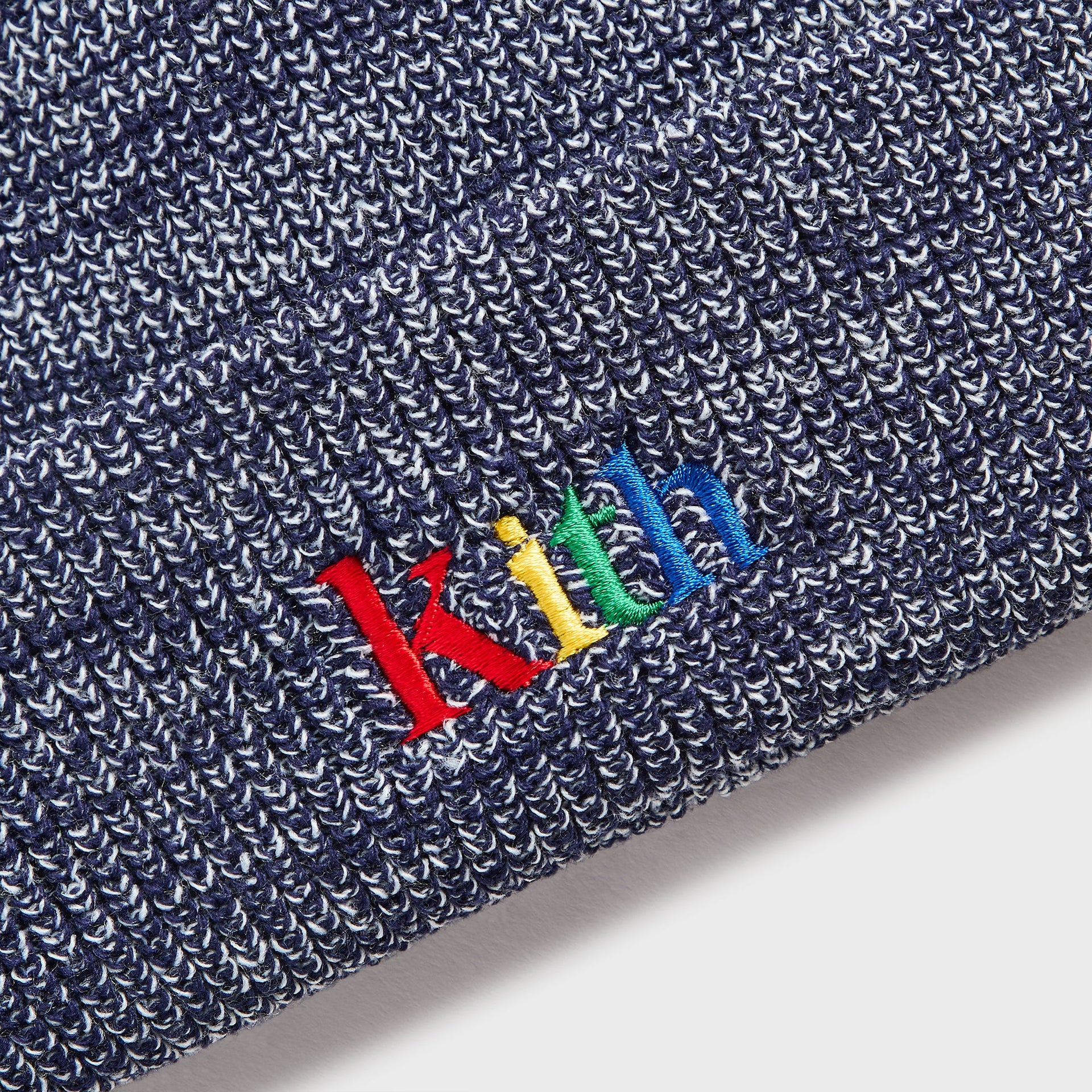 Kith Kids Marled Yarn Classic Beanie close-up of multicolor Kith embroidery on navy marled ribbed knit