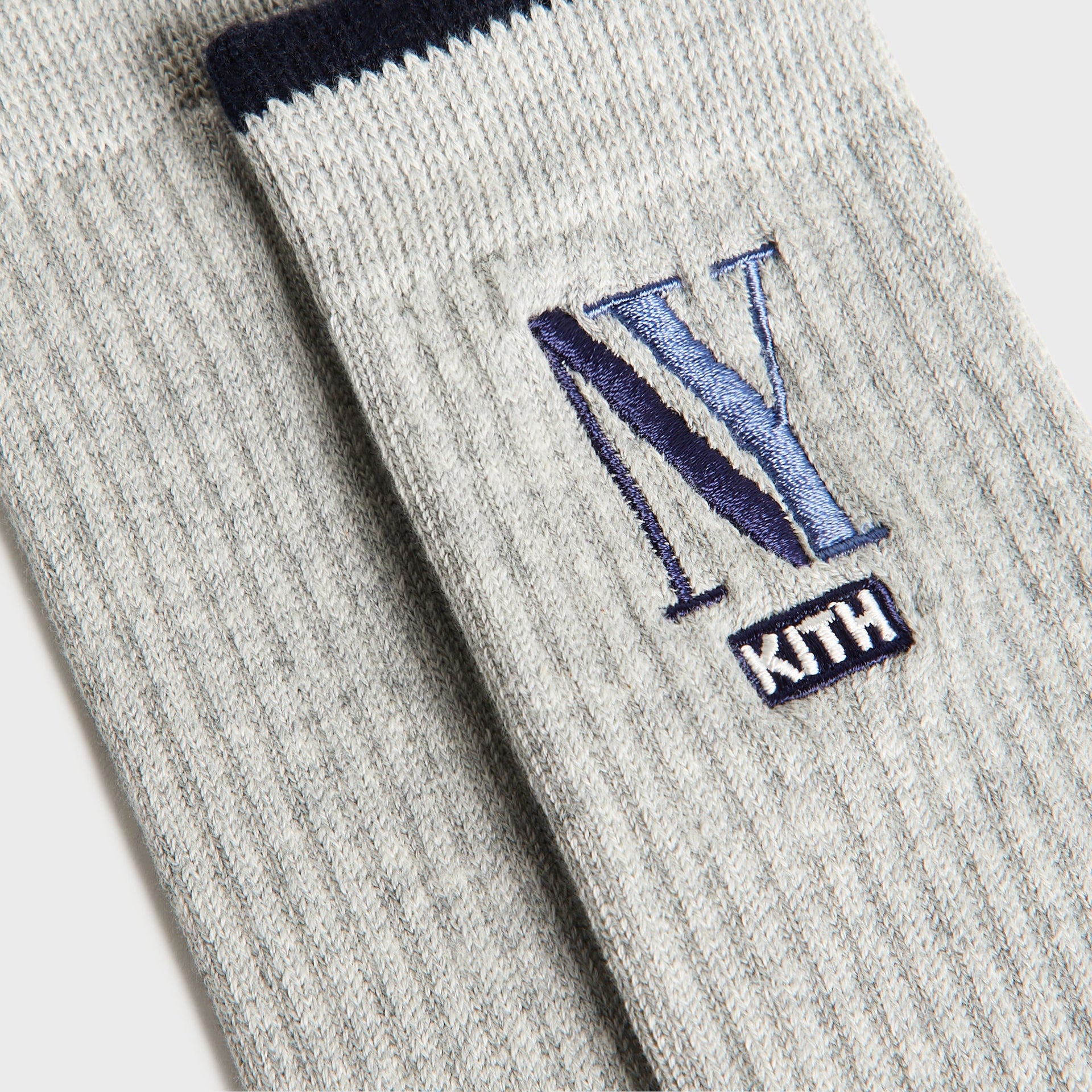 Kith Kids NY Socks, close-up of heather grey sock with navy stripe and NY Kith embroidery