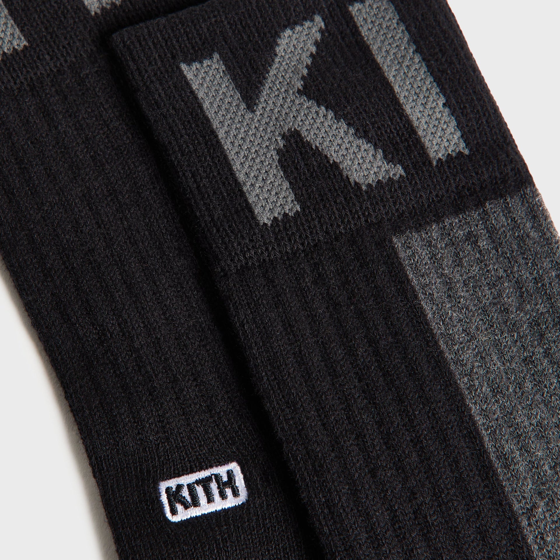 Kith Kids 3-Pack Color-Blocked Socks black and charcoal pair detail with embroidered white KITH tag