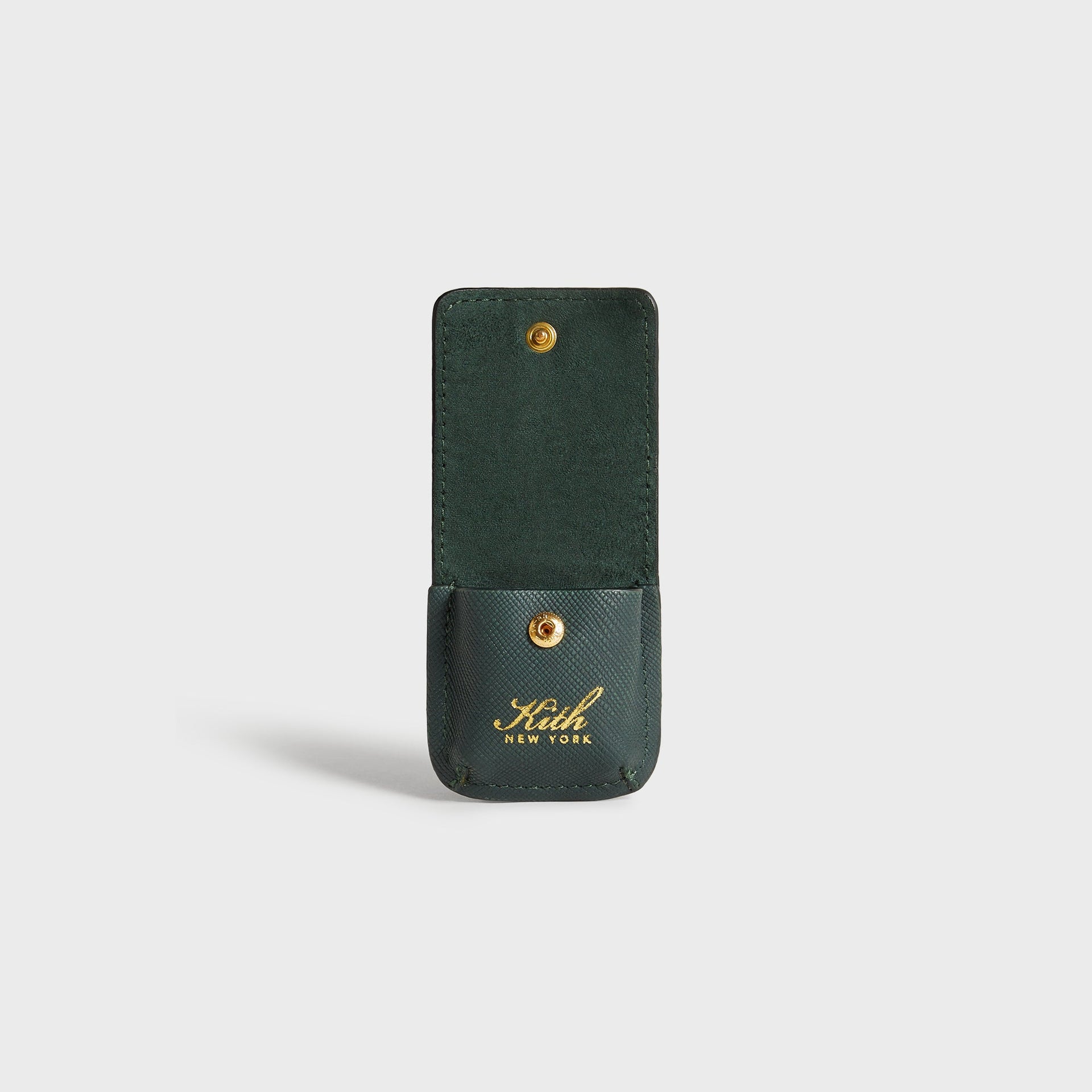 Kith Monogram Lighter Case in Stadium, open flap view revealing suede-lined interior and snap closure