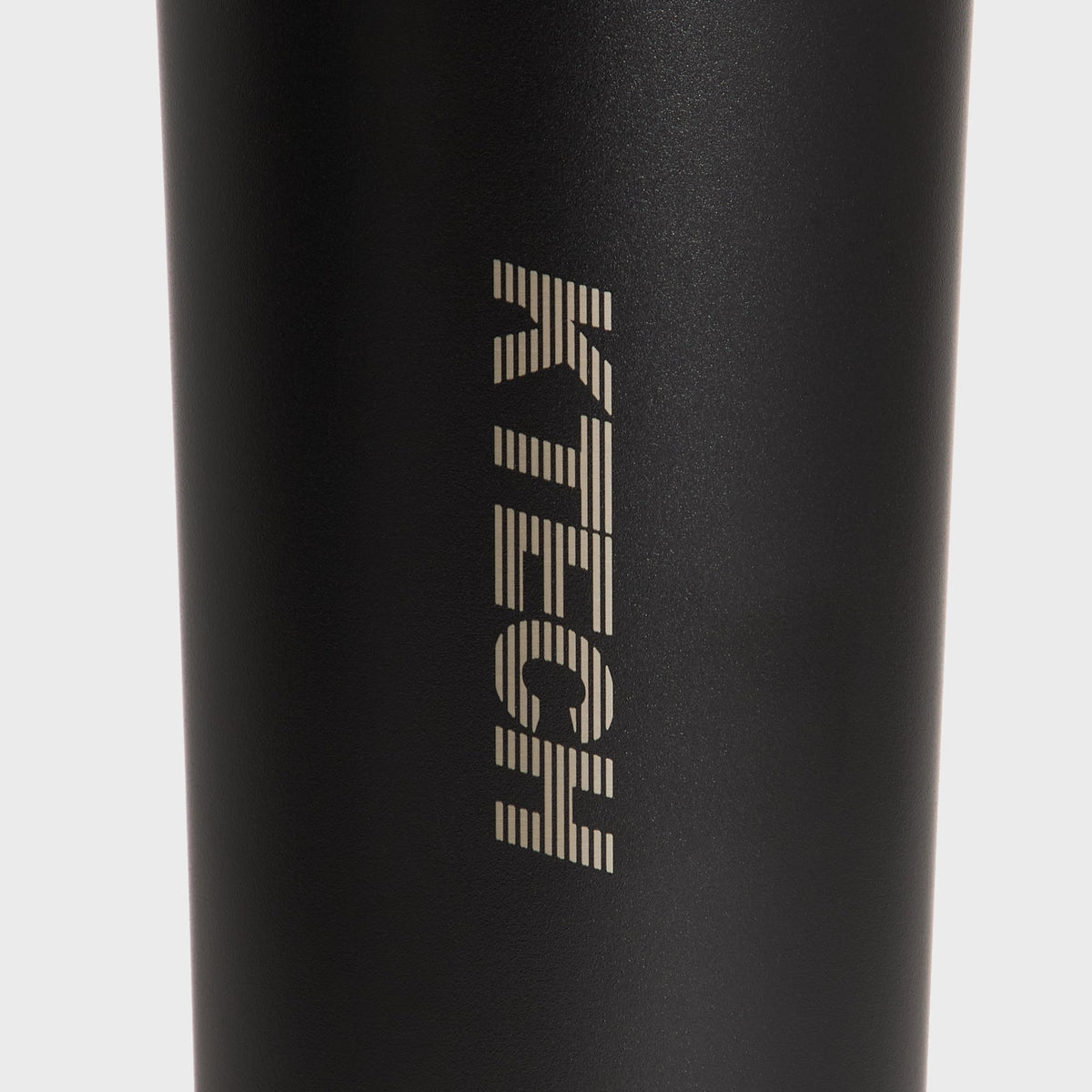 Close-up of the engraved KTECH logo on the Kith for Corkcicle Classic Sport Canteen body